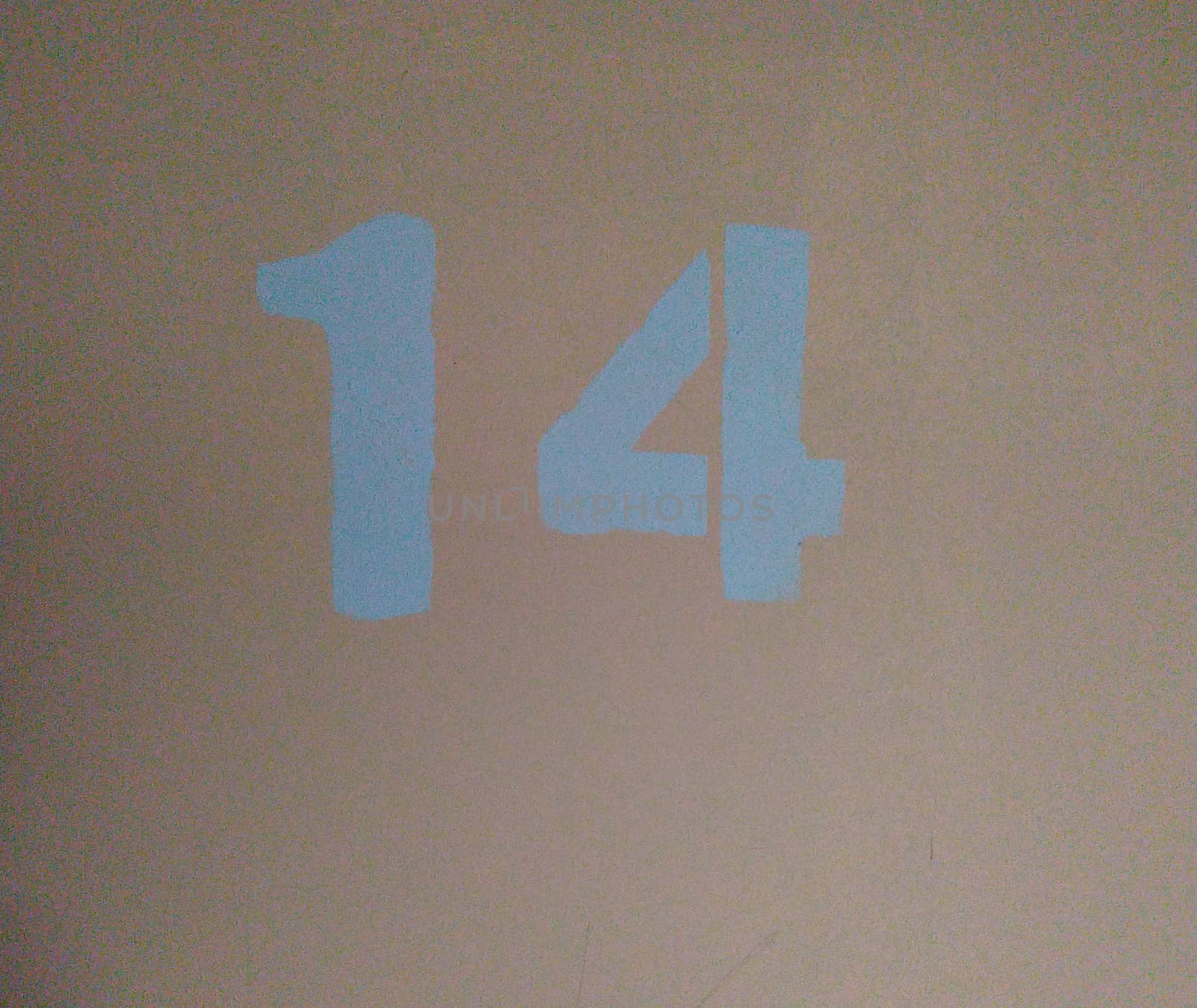 The number 14 painted with blue paint on a pink background. Symbol.