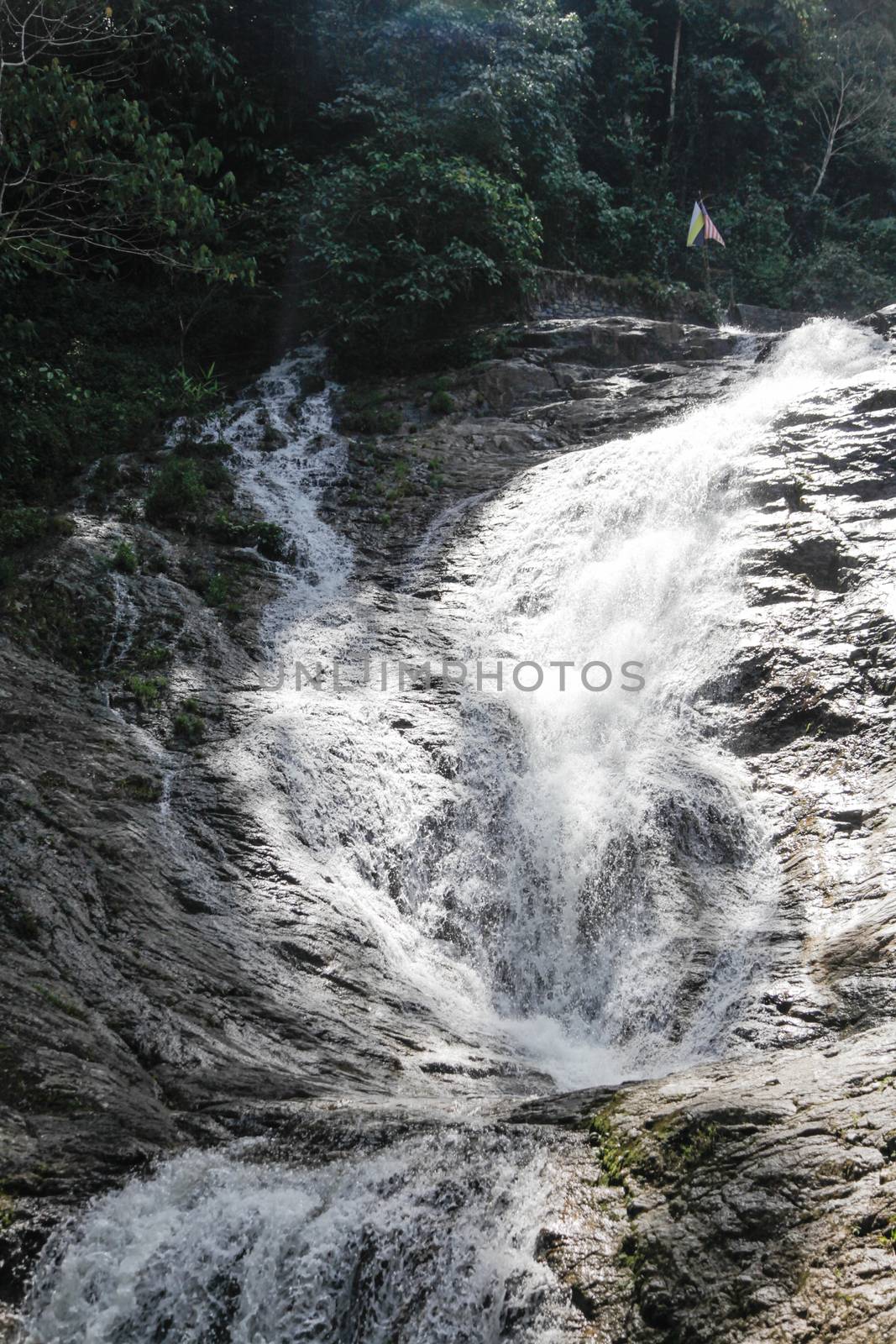 Waterfall from mountain streaming down by haiderazim