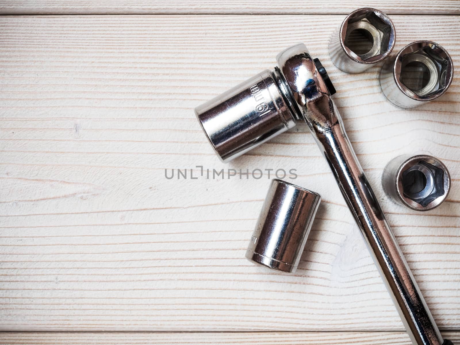 Several spanners on wooden board. Construction concept