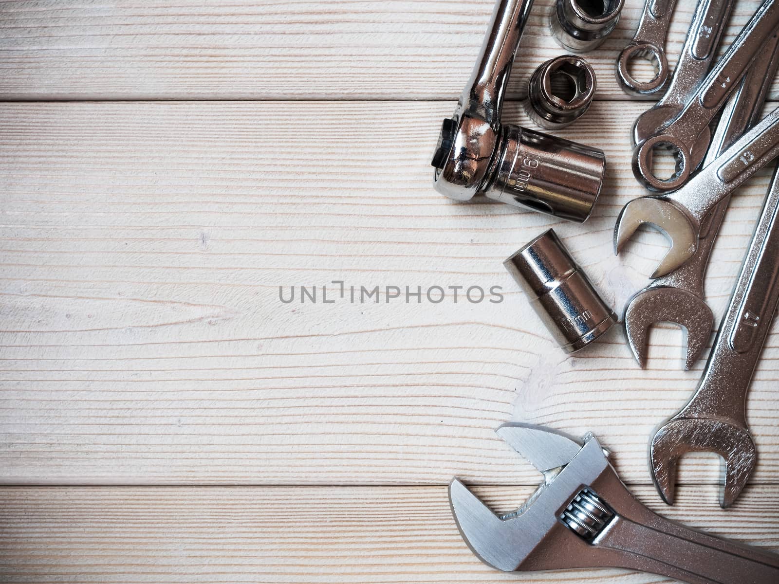 Several spanners on wooden board. Copy space. Construction concept