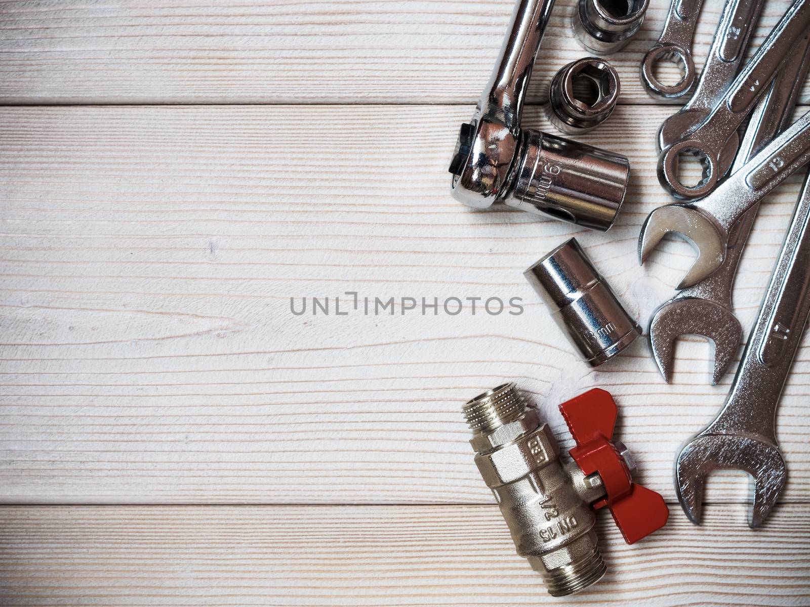 Several spanners on wooden board. Copy space. Plumbing concept