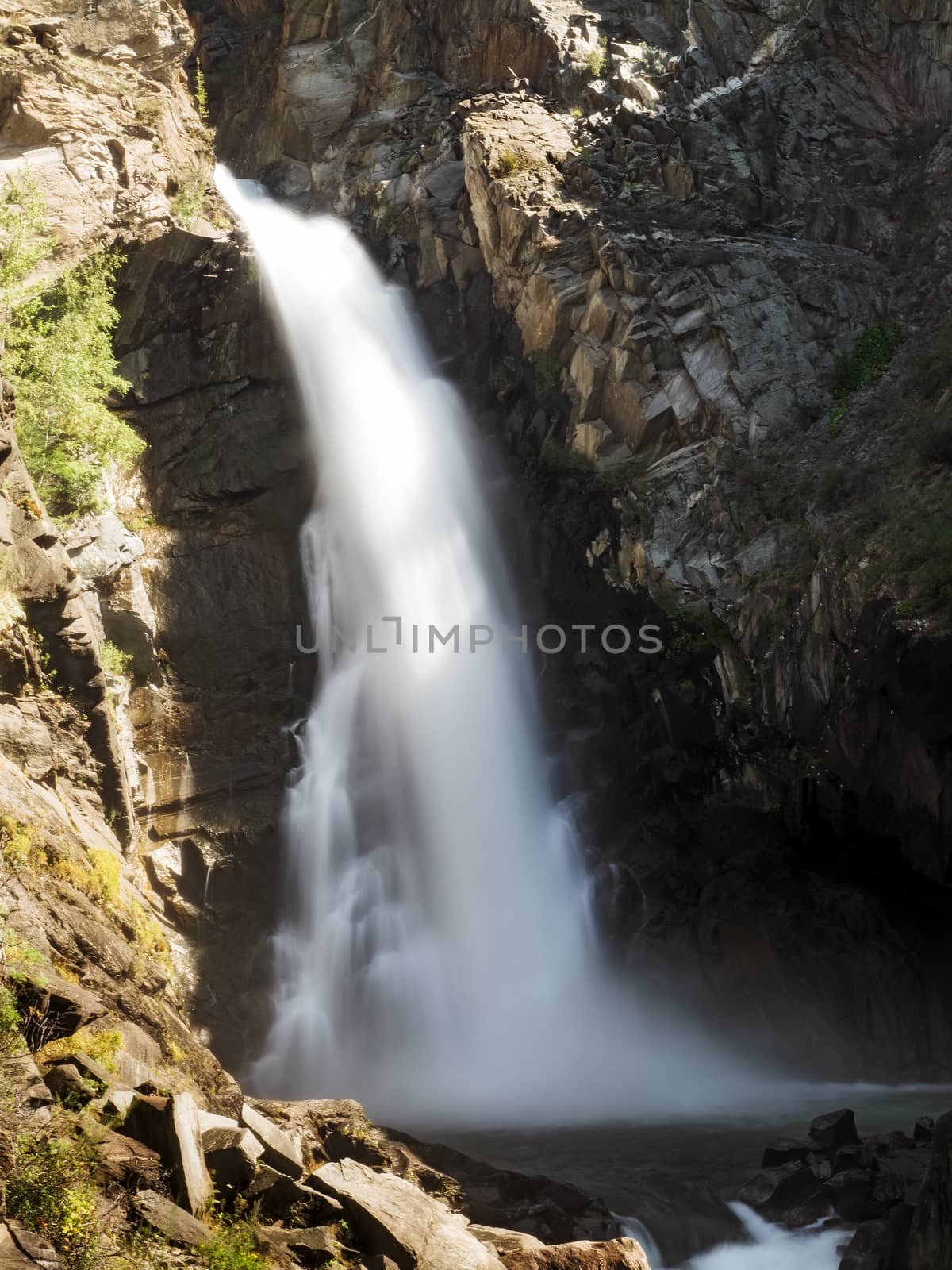 Waterfall in the mountains. Altai Republic, Russia