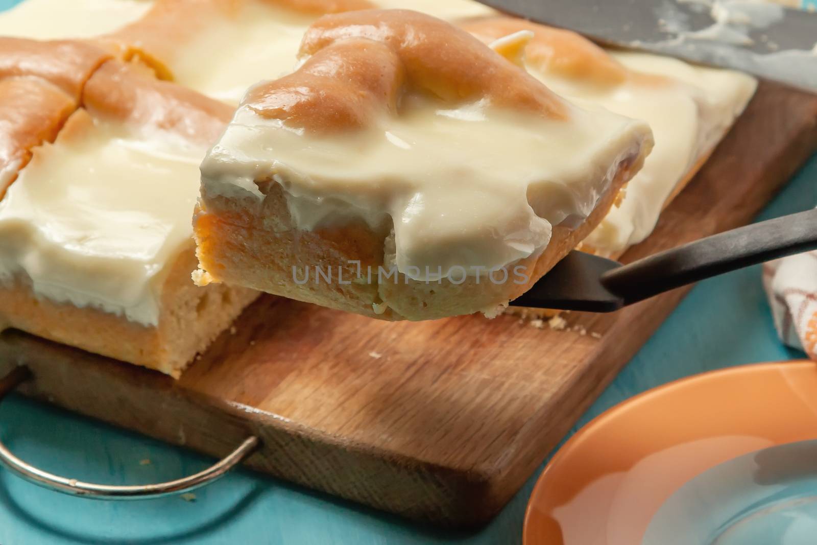 Sliced Apple Pie with Sour Cream on Wooden Cutting Board - photo, image by galsand