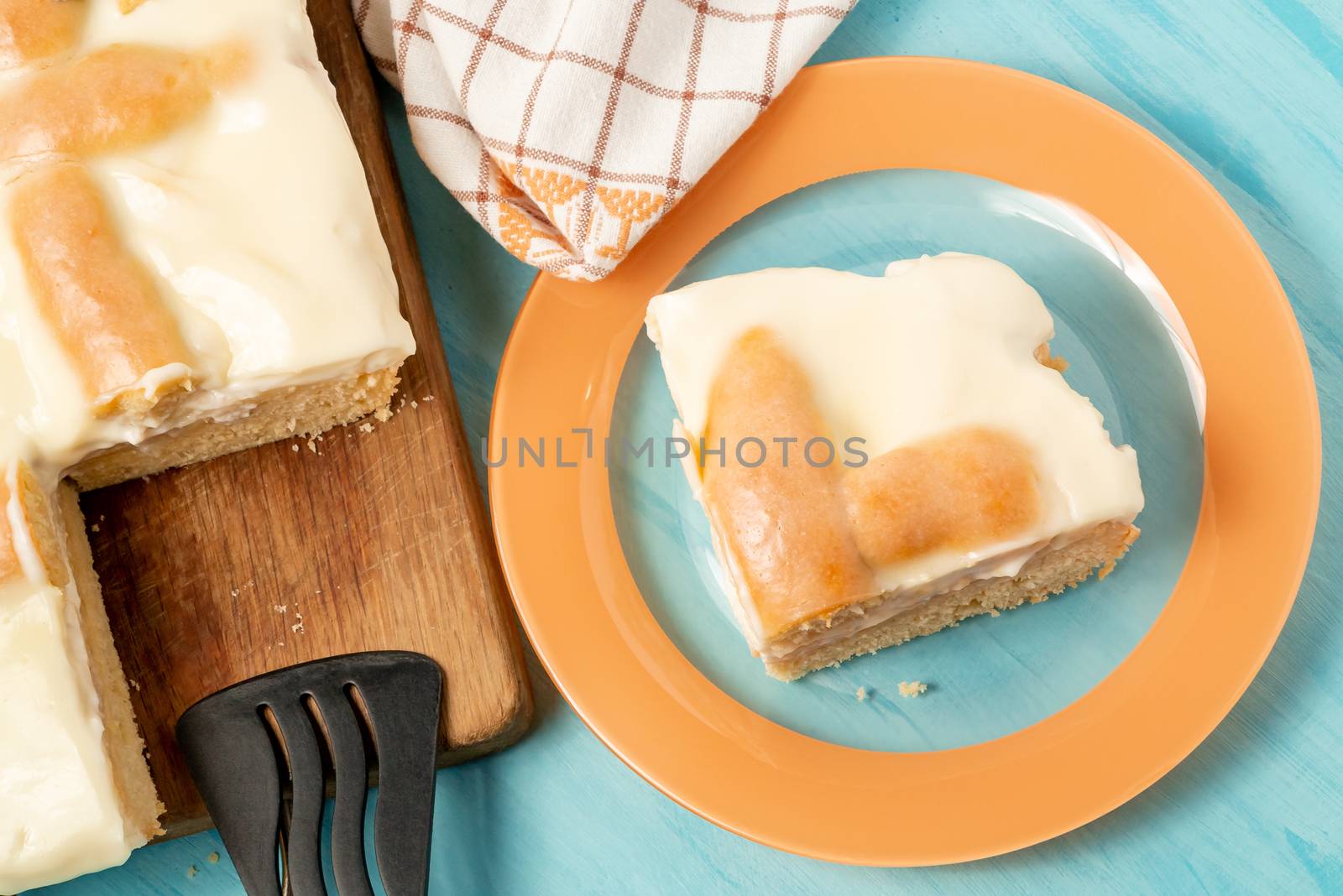 Sliced piece of apple pie with sour cream on a plate - photo, image.