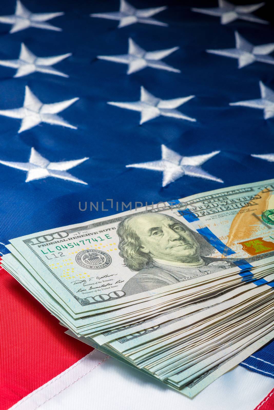 view of a bunch of money lying on the flag of the united states of america