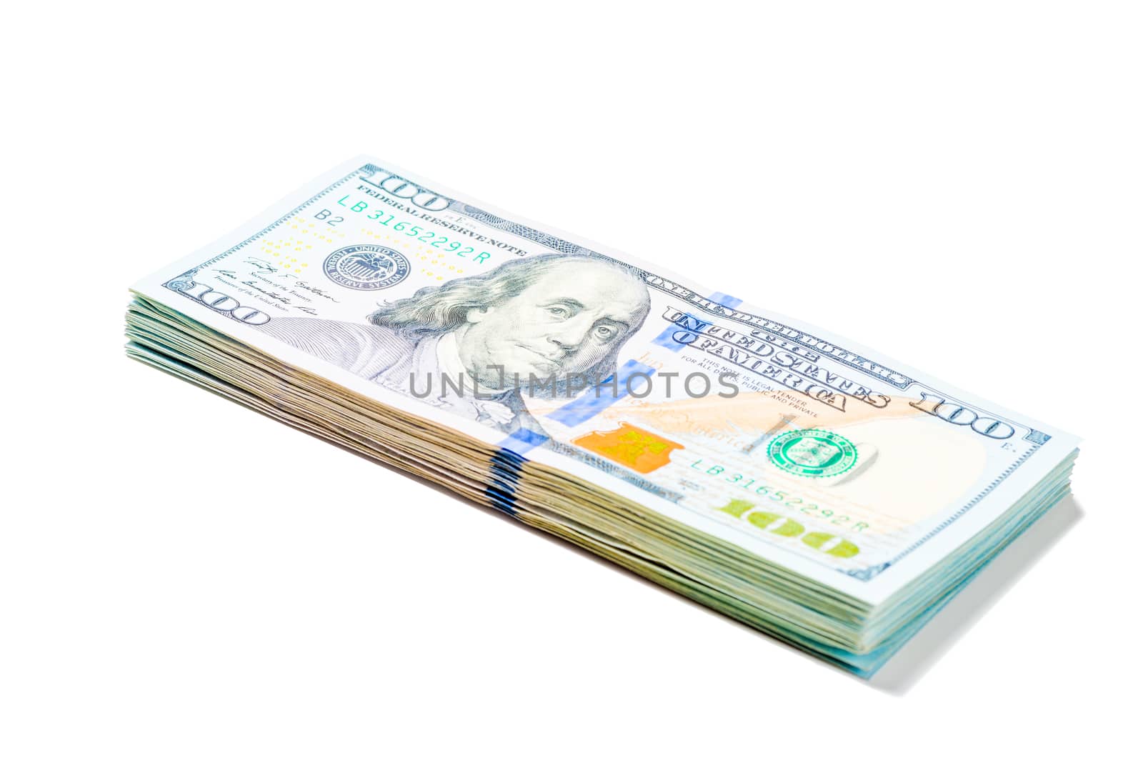 stack of 100 dollar bills piled on white background isolated