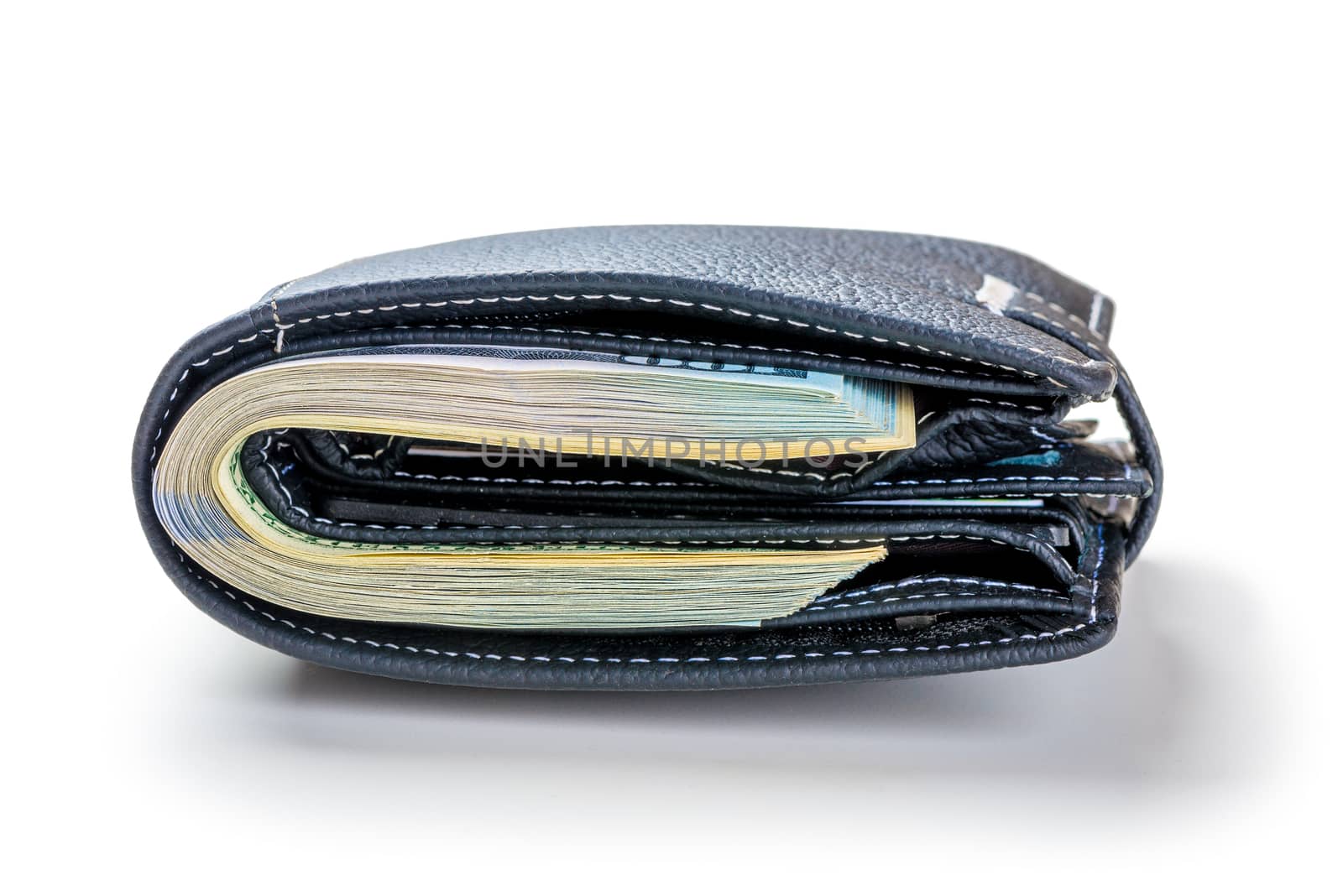 Tight-packed wallet with 100 dollar bills on a white background by kosmsos111