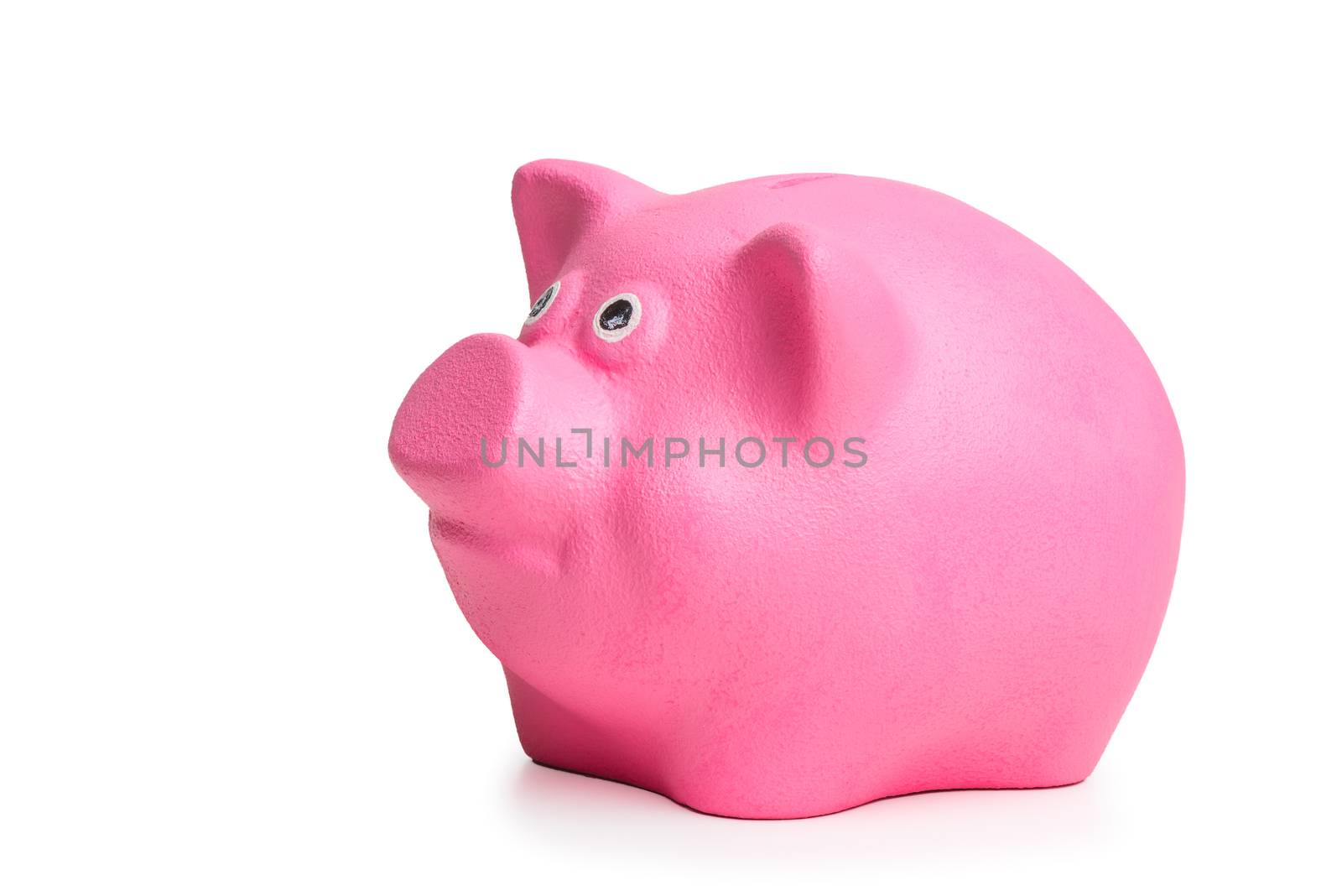 pink piggy bank isolated on white background side view