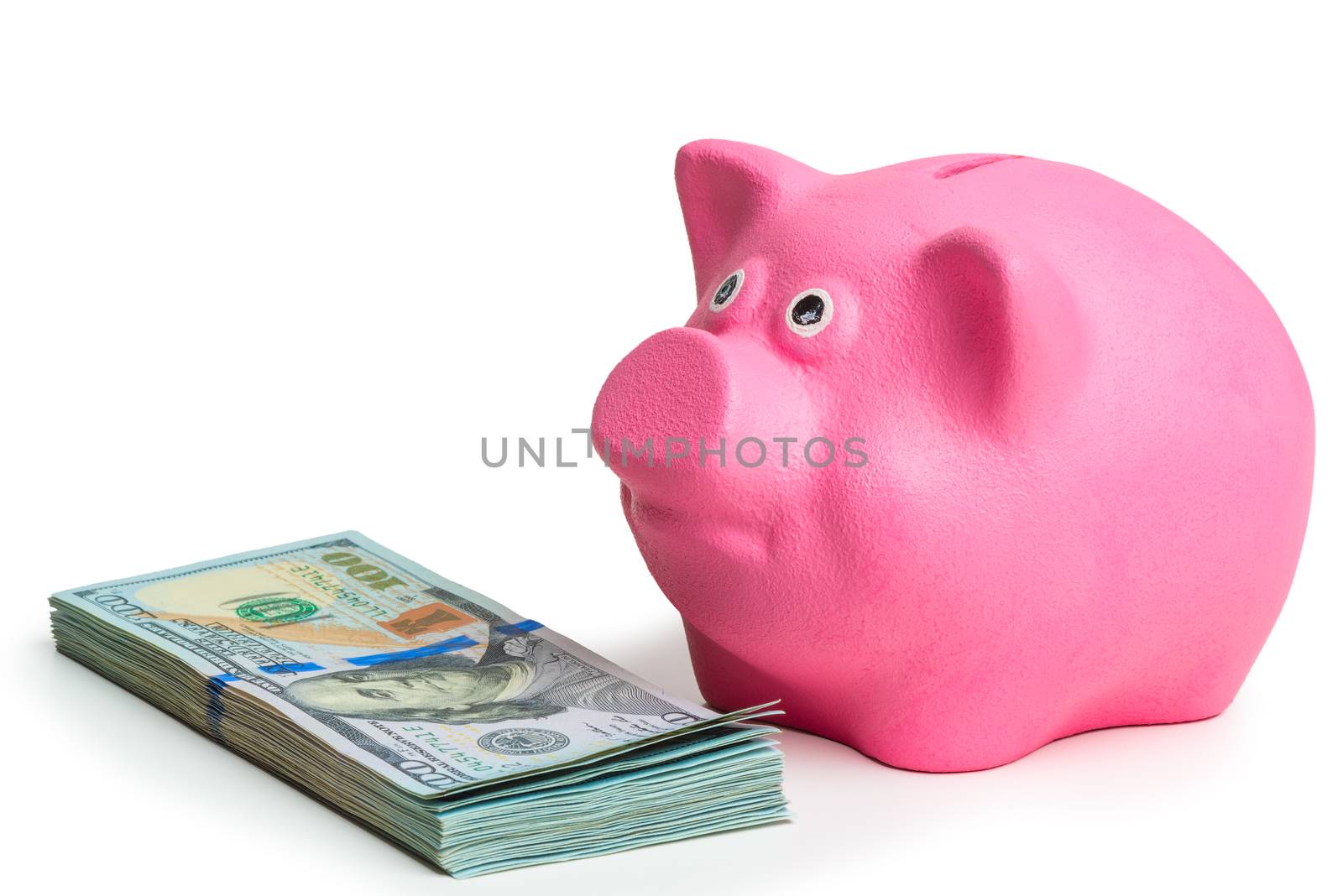 pink piggy bank and pile of american dollars on white background by kosmsos111