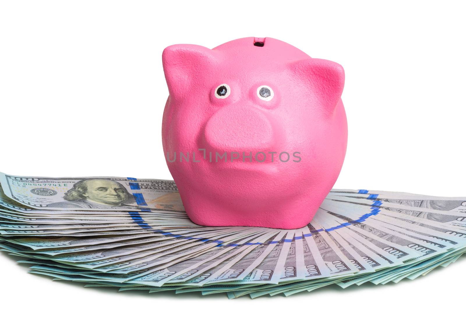 pink piggy bank standing on a fan of a pile of american dollars by kosmsos111