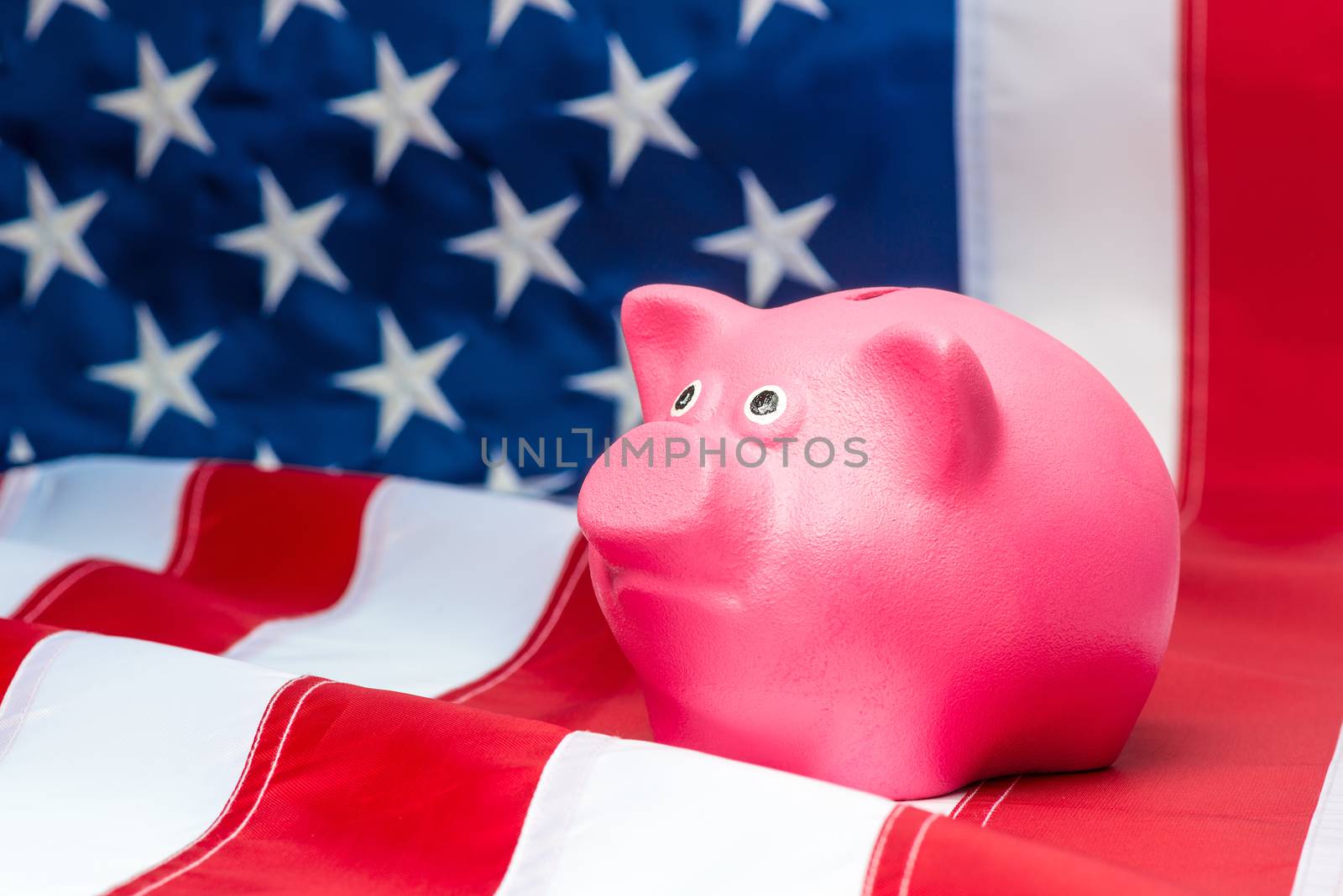 American flag and pink piggy bank close up