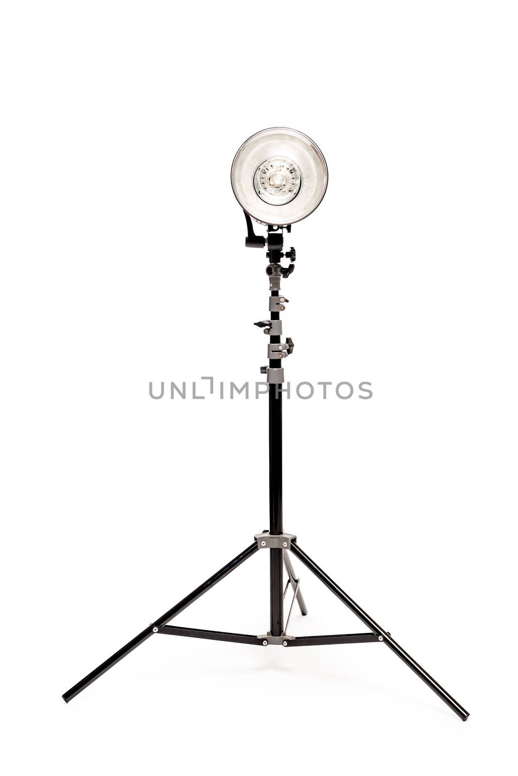 Powerful photo flash on the rack on a white background in the studio