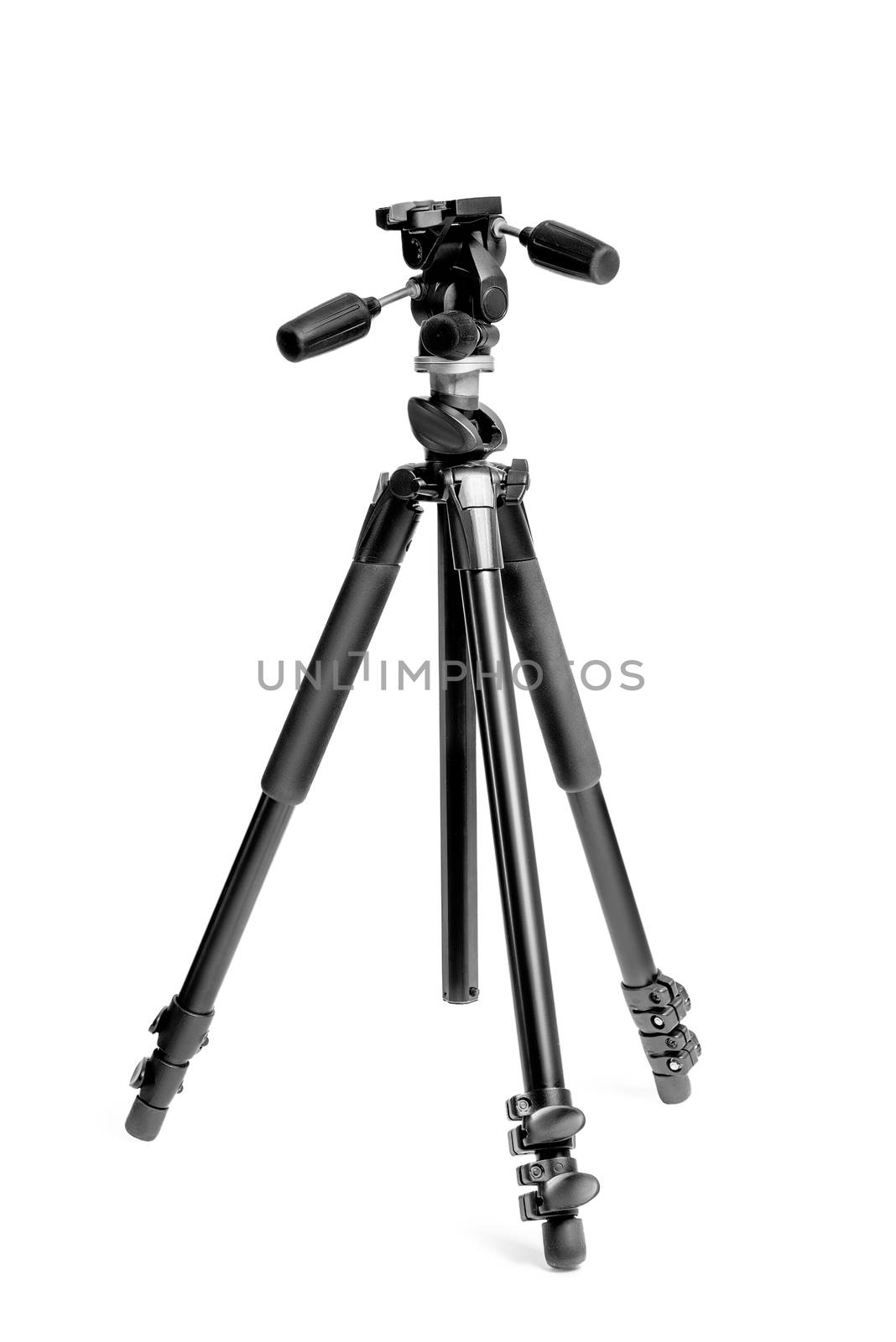 tripod for photo camera in photo studio on white background close-up