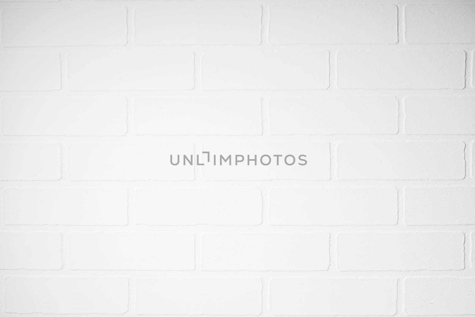 closeup white brick wall in photo studio background by kosmsos111