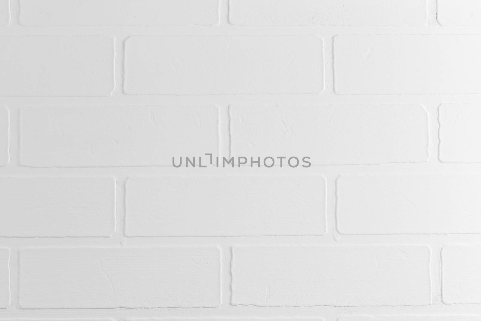 white brick wall in photo studio background closeup texture by kosmsos111