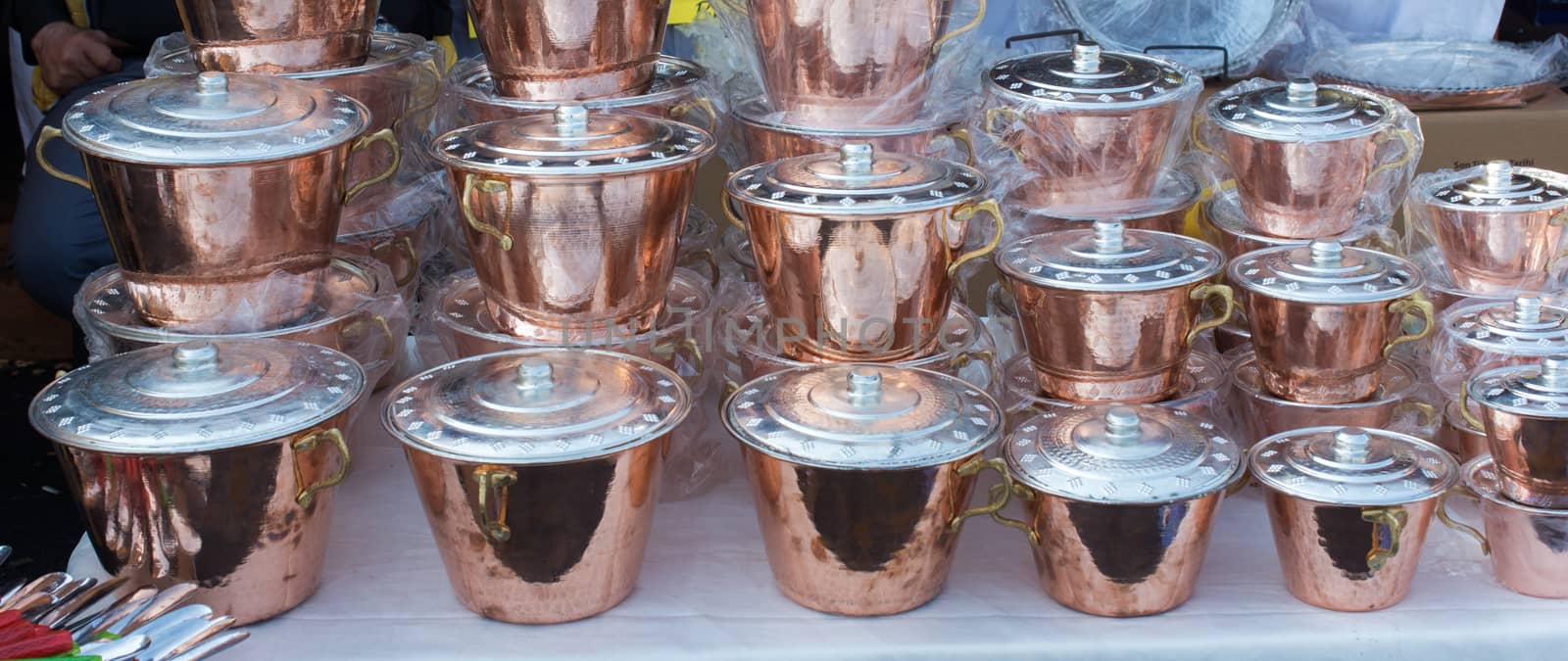 Little set of buckets of made of metal in a market place