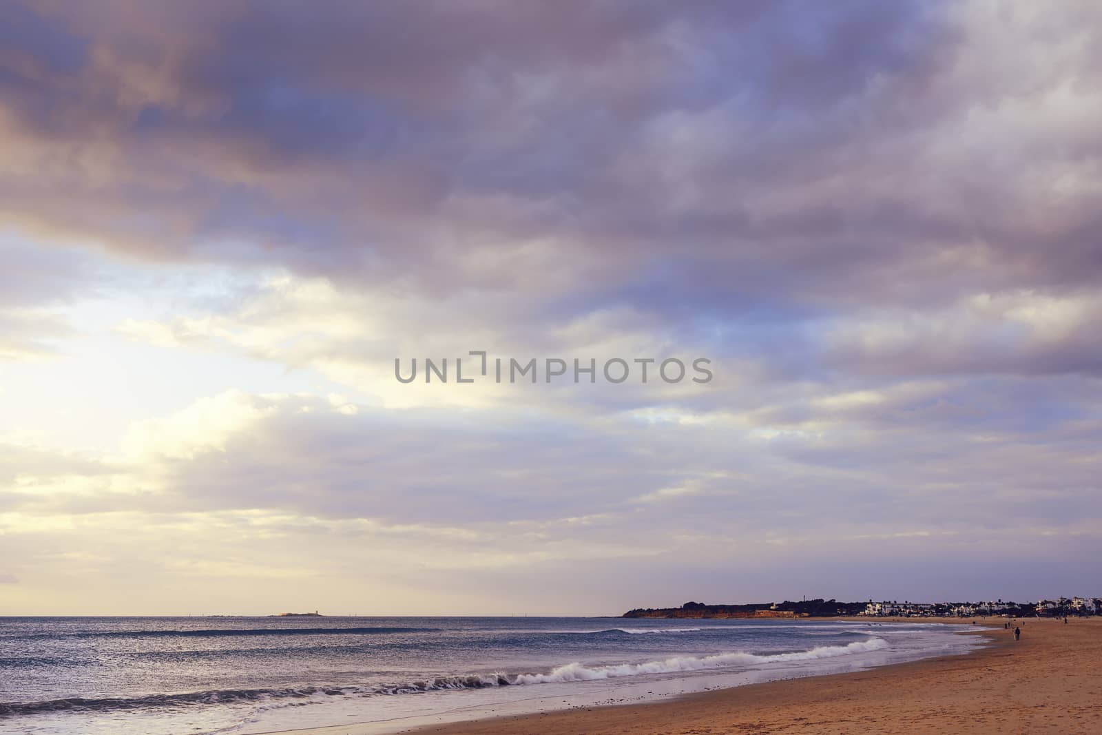 lonely beach at sunset in Chiclana, Cadiz, Andalusia, Spain