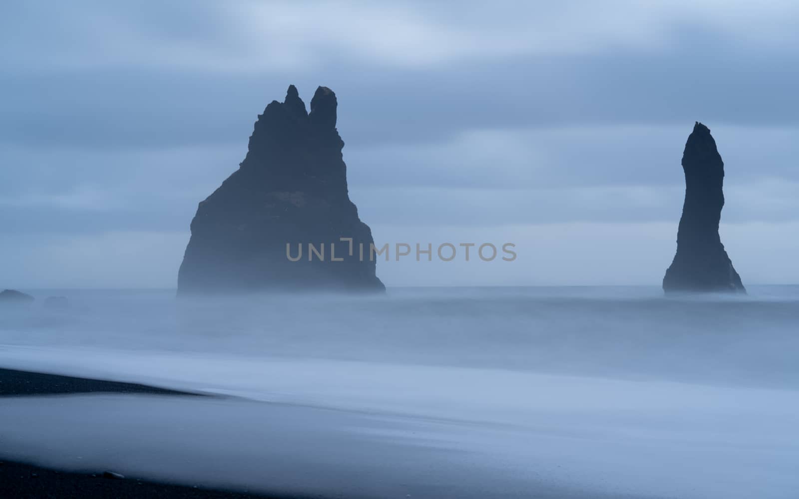 Rock spire of Reynisdrangur, coast of Reynisfjara close to Vik, Iceland, Europe