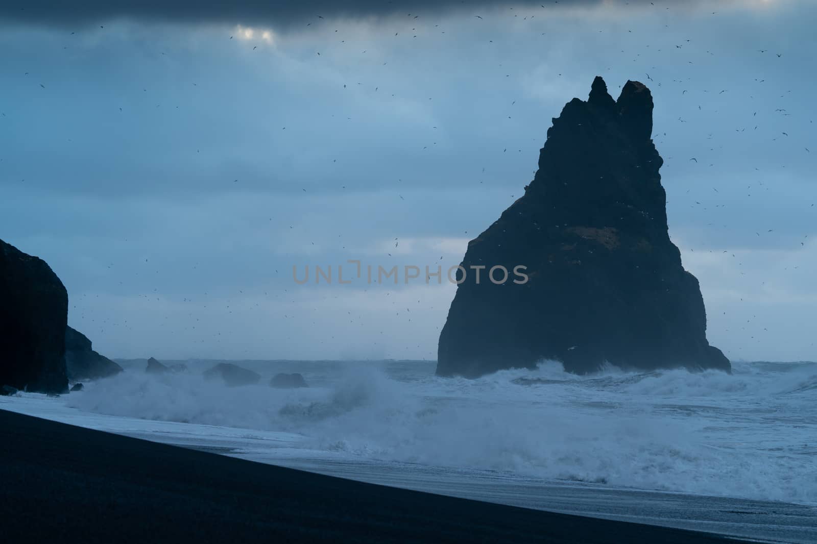 Rock spire of Reynisdrangur, coast of Reynisfjara close to Vik, Iceland, Europe