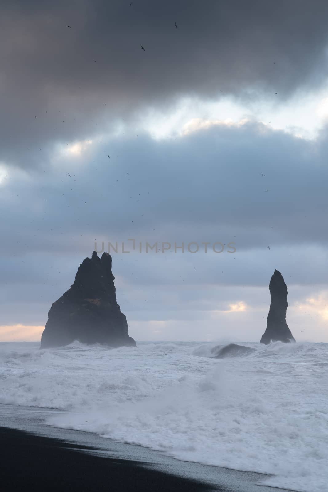 Rock spire of Reynisdrangur, coast of Reynisfjara close to Vik, Iceland, Europe