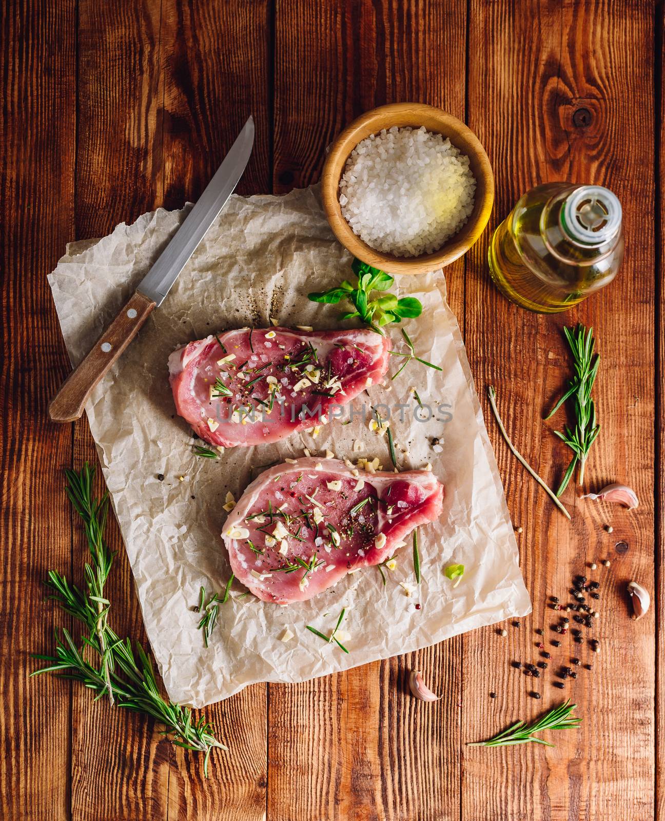 Raw Pork Rib-Eye Steaks with Ingredients. View from Above.