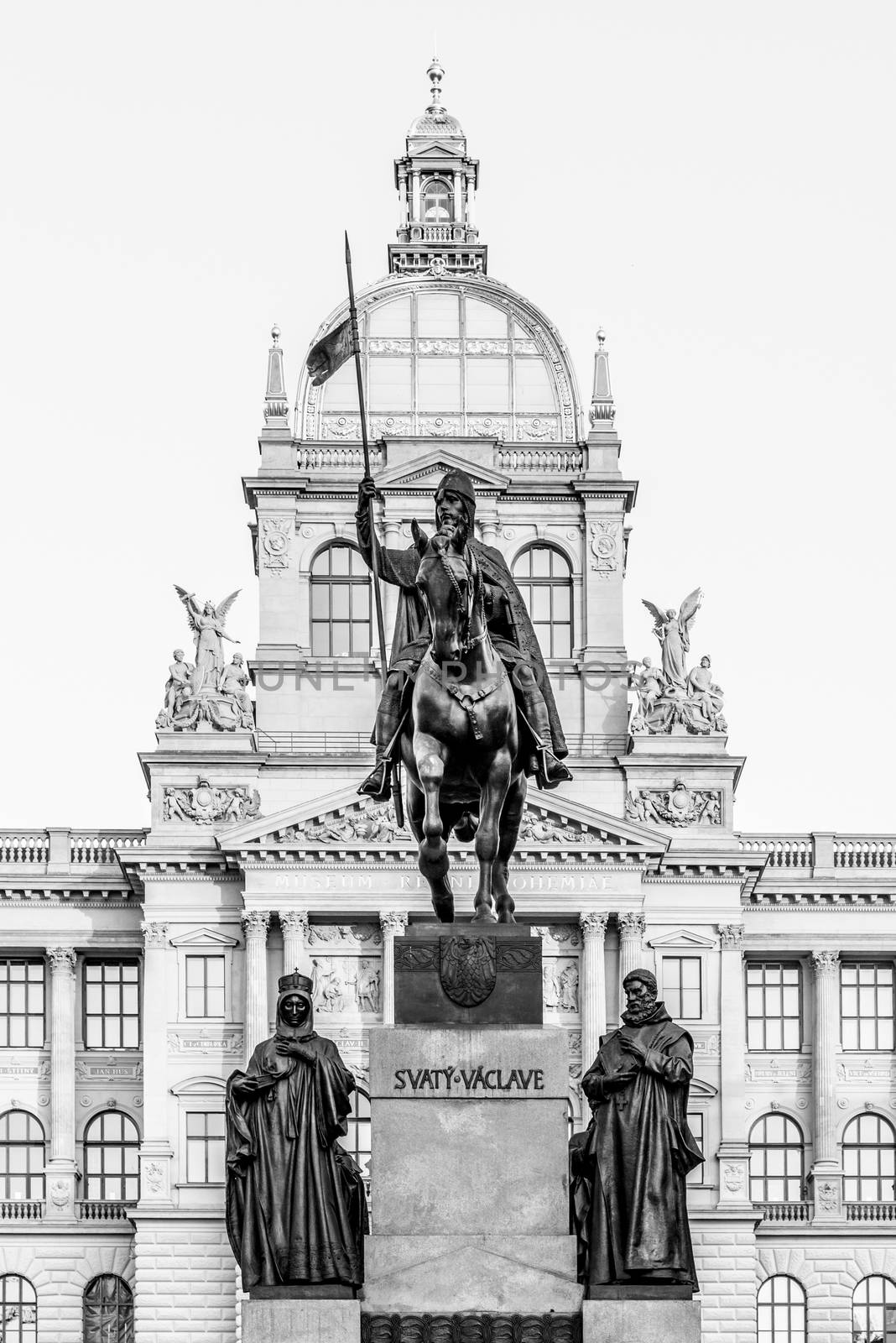 The bronze equestrian statue of St Wenceslas at the Wenceslas Square with historical Neorenaissance building of National Museum in Prague, Czech Republic by pyty