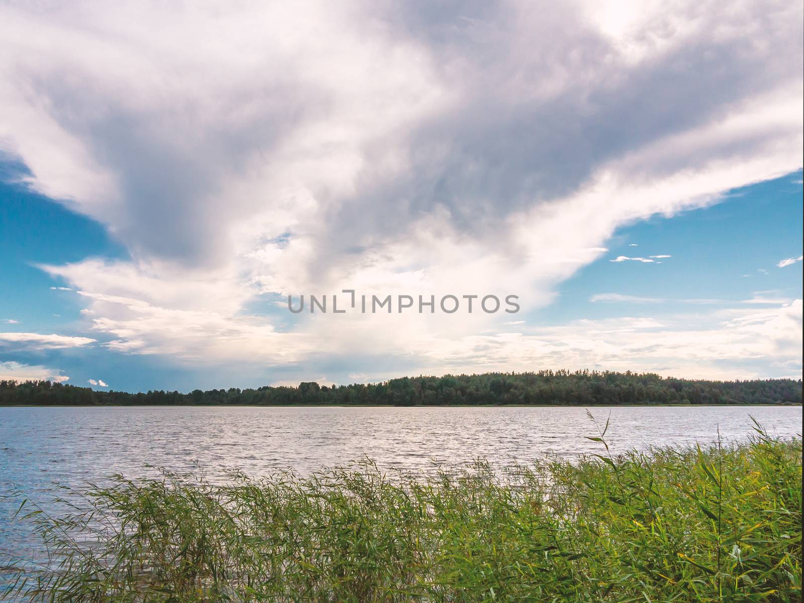 Beautiful clouds in the blue sky over the lake by galsand
