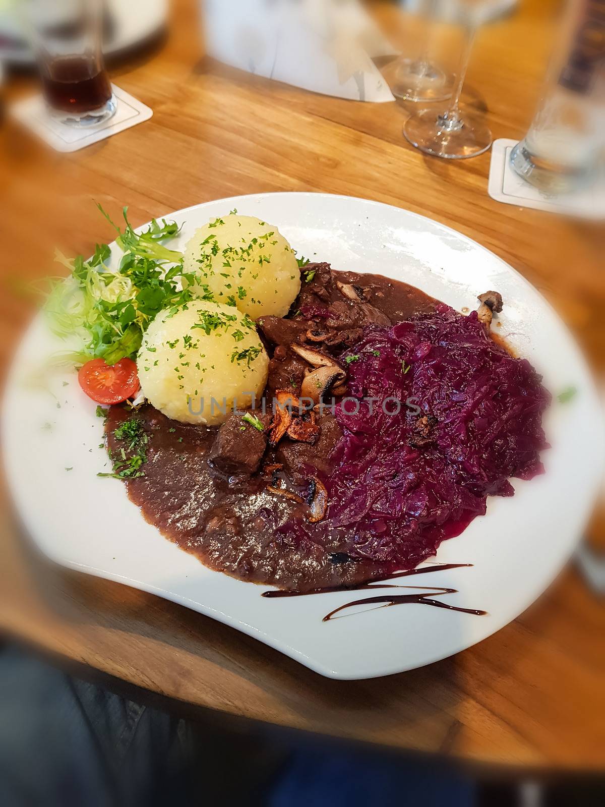 Gourmet game fillet with potato dumplings, goulash garnished