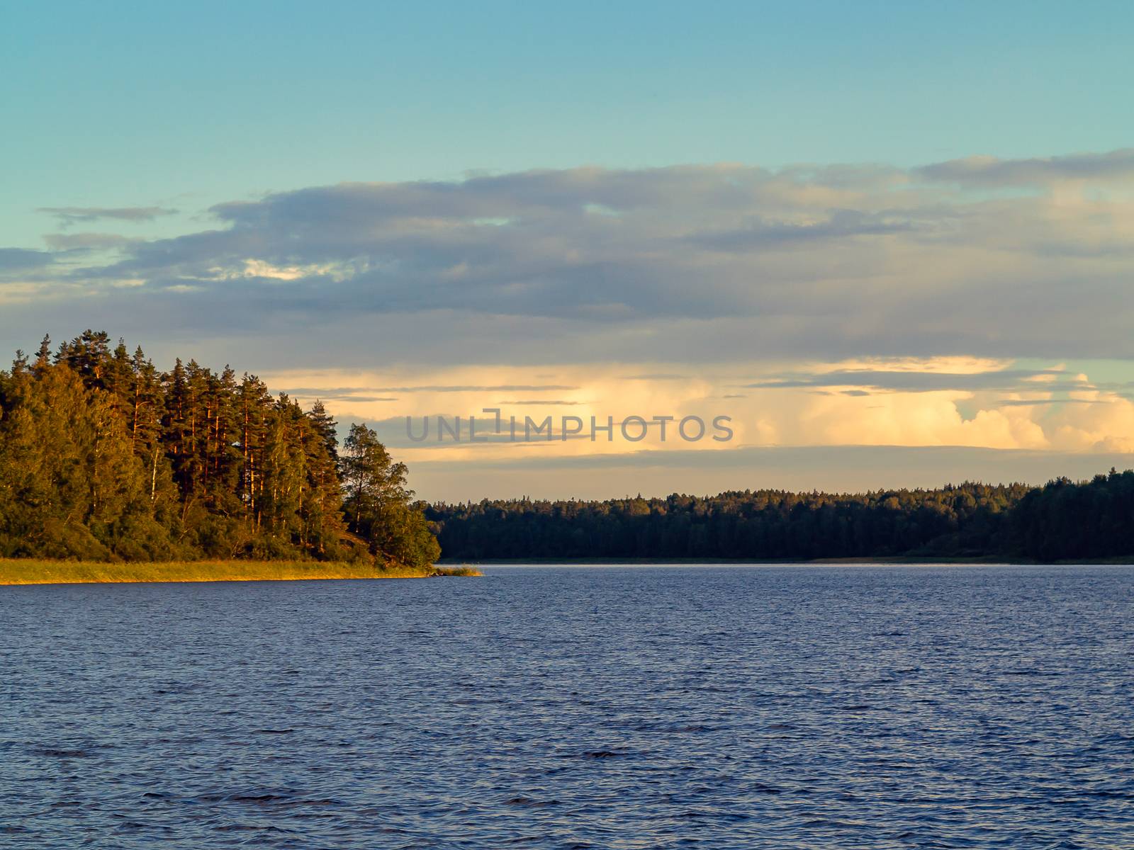 Beautiful clouds over the lake at sunset on a summer day by galsand