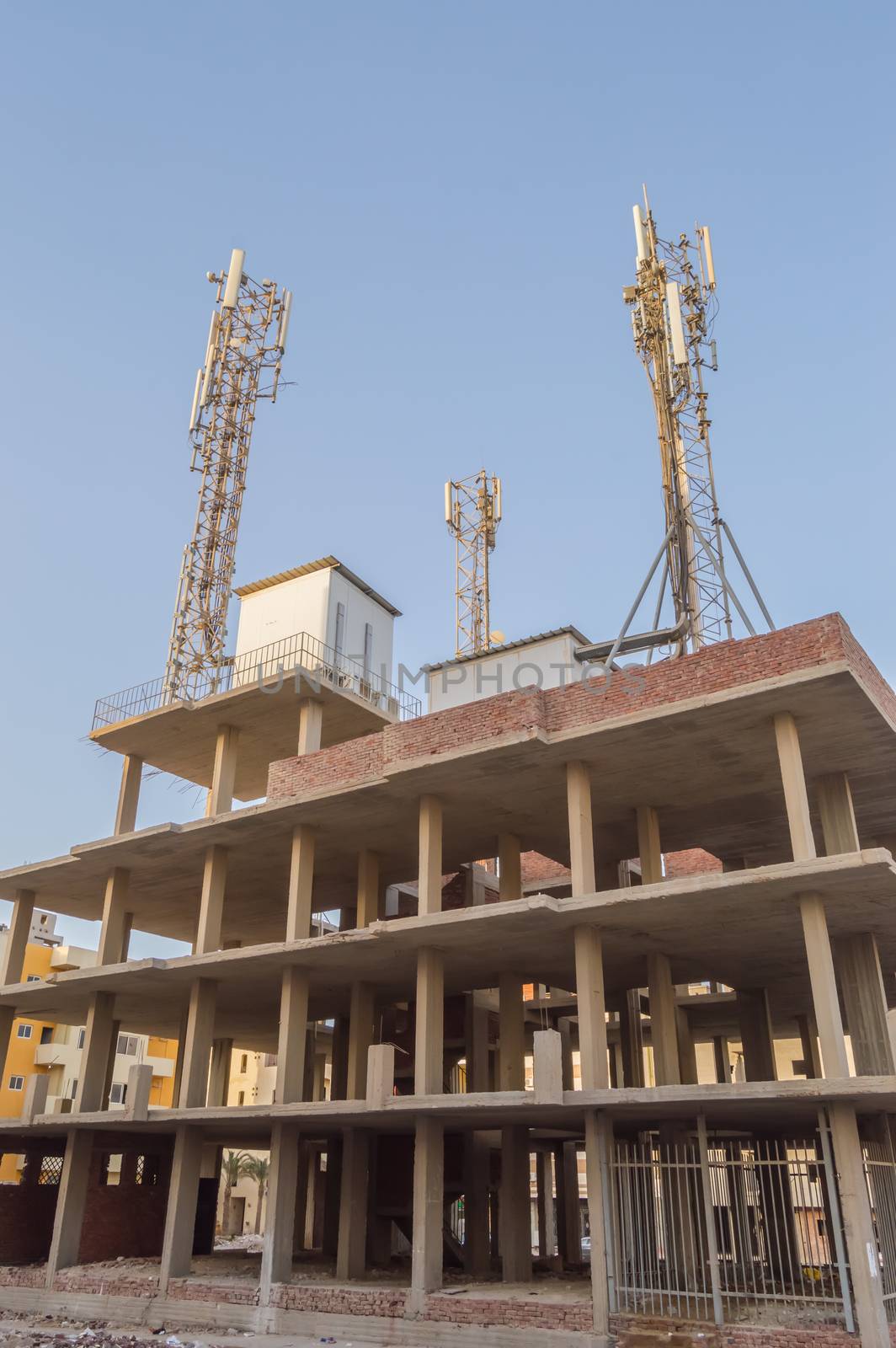 Three communication antennas on a building  by Philou1000