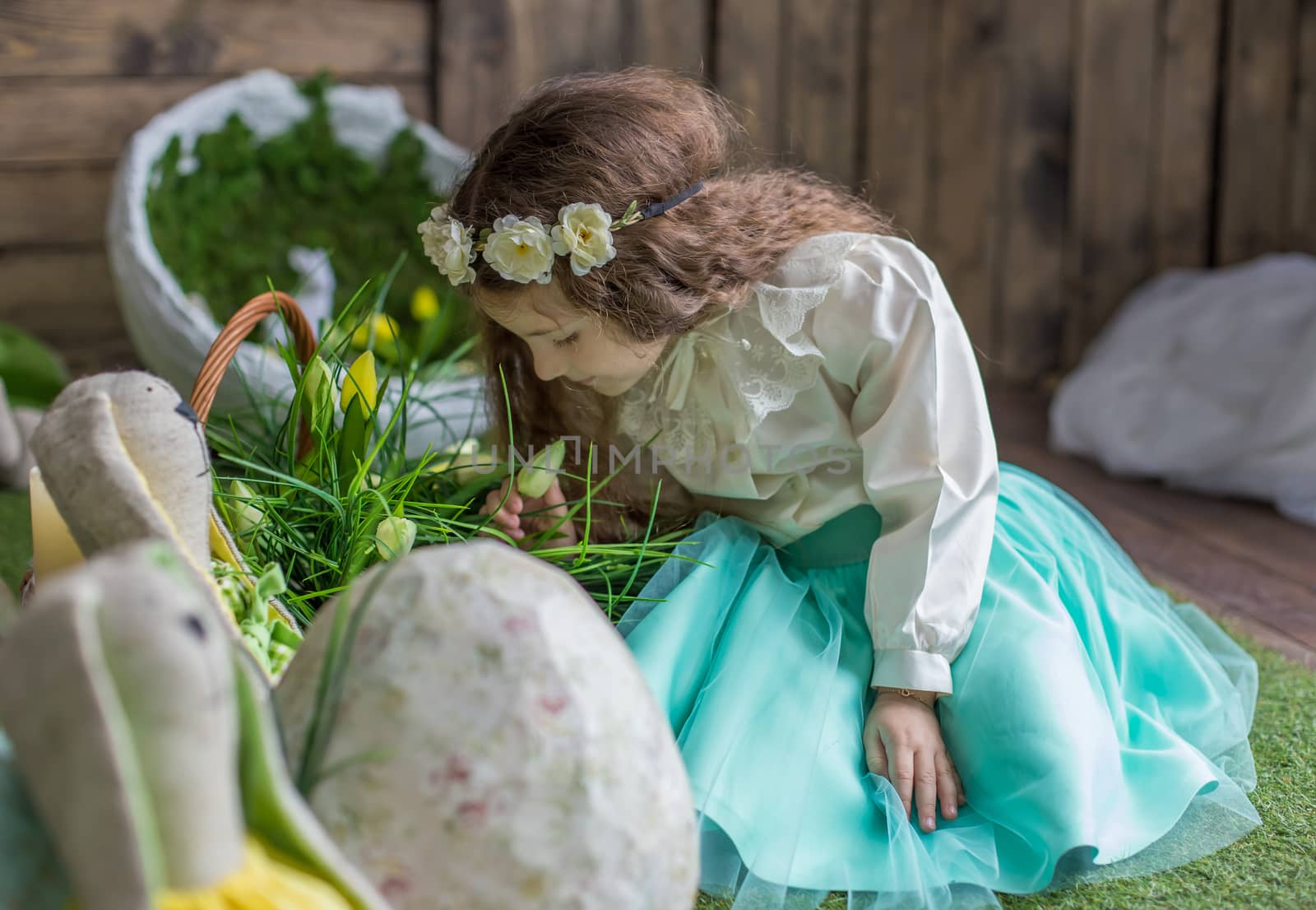 Little girl with wreath among Easter decoration by Angel_a