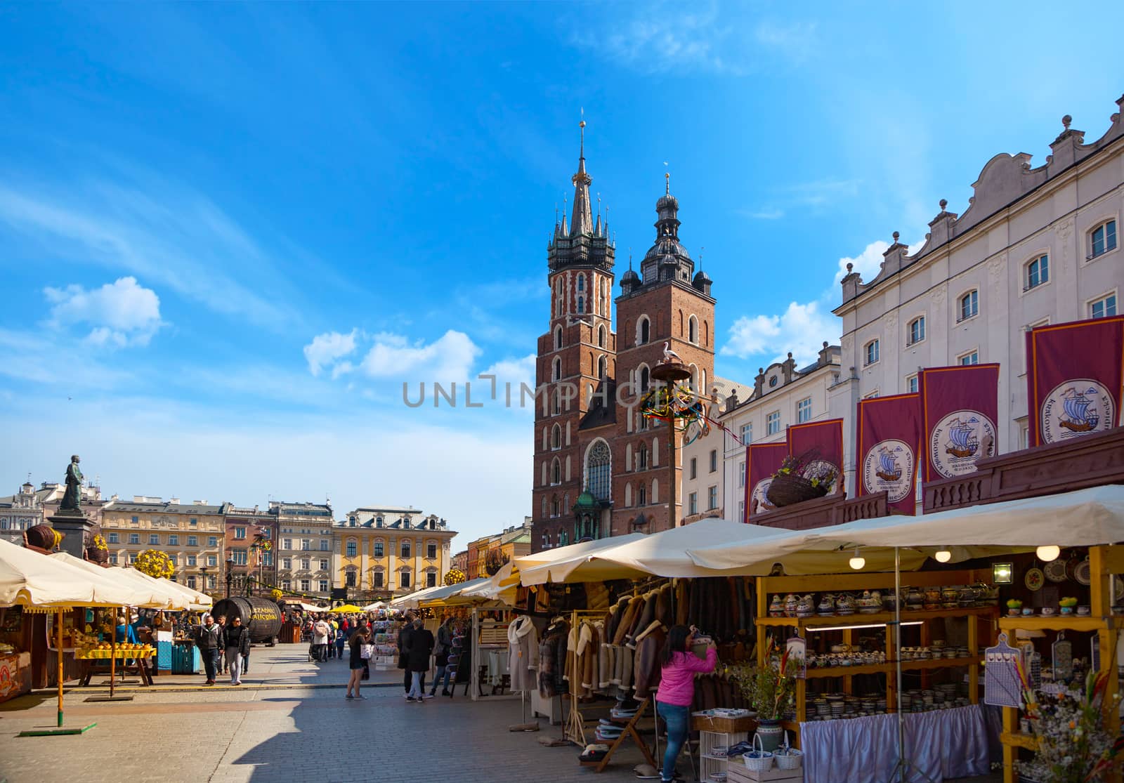 CHISINAU, MOLDOVA - APRIL 19, 2019: Old city center view with Adam Mickiewicz monument and St. Mary's Basilica in Krakow