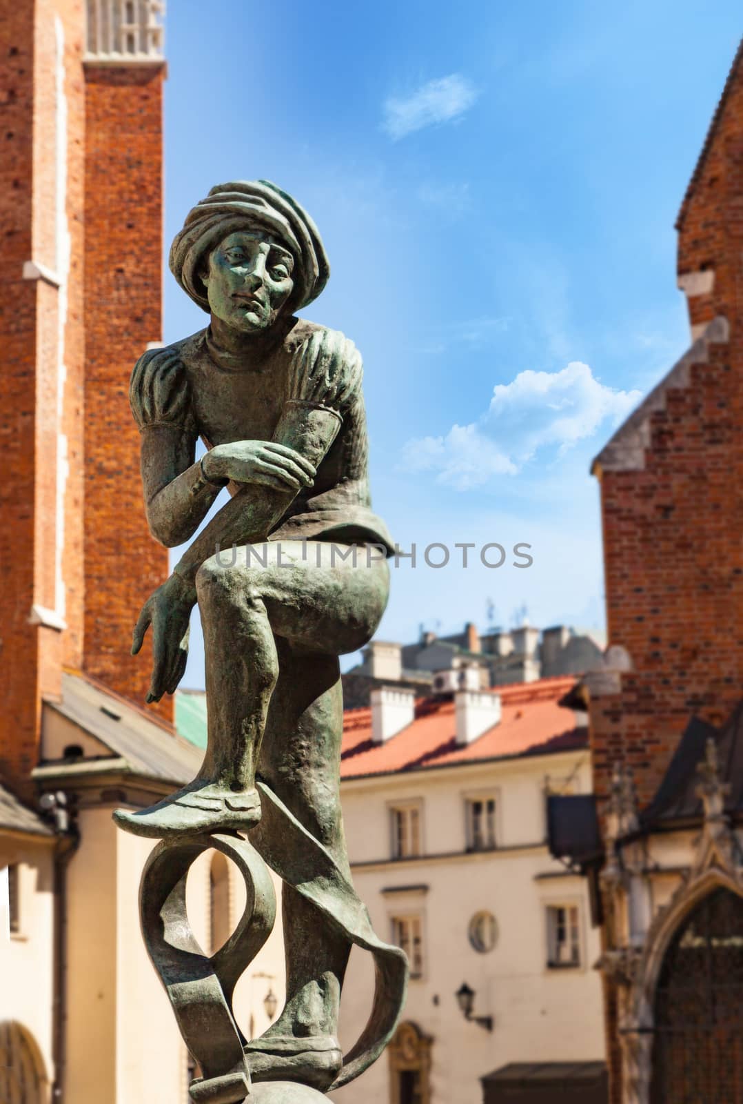 CHISINAU, MOLDOVA - APRIL 19, 2019: Bronze statue of a poor student near St Mary's Basilica located in Krakow, Poland