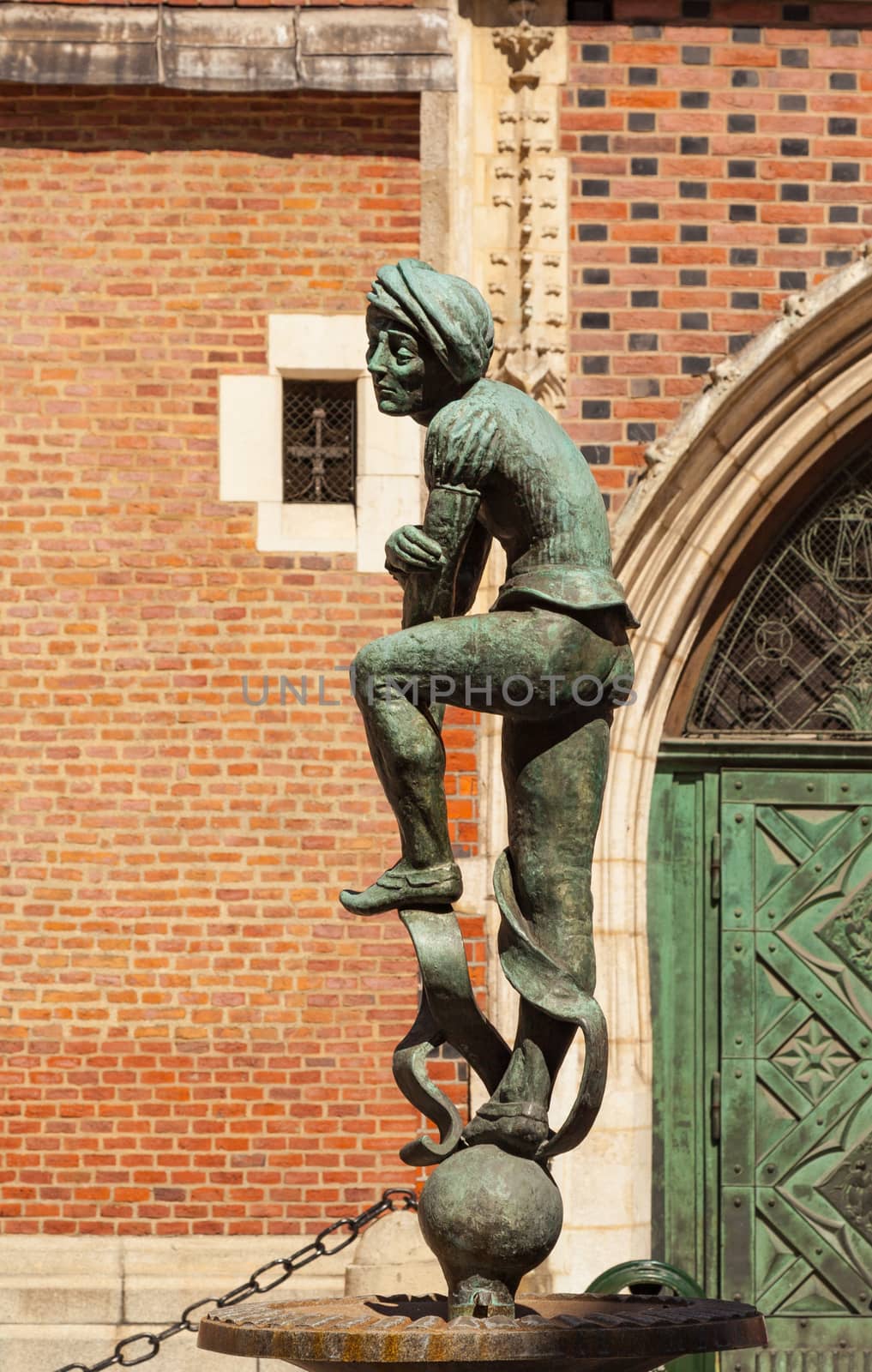 CHISINAU, MOLDOVA - APRIL 19, 2019: Bronze statue of a poor student near St Mary's Basilica located in Krakow, Poland