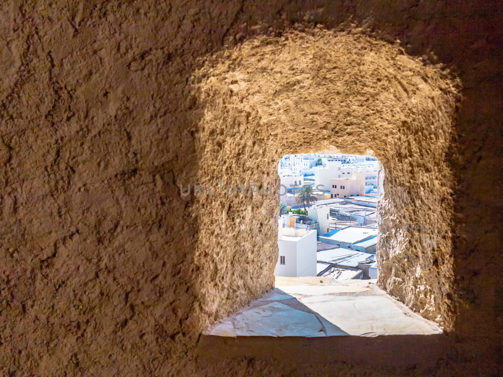 View of the city of Muscat, the capital of Oman through the loophole of Fort Muttrah by galsand