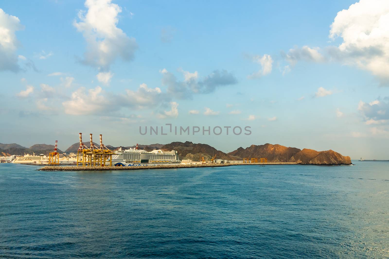 Muscat, Oman - December 16, 2018: Tourist liner at the coast in the fjords of the Gulf of Oman.