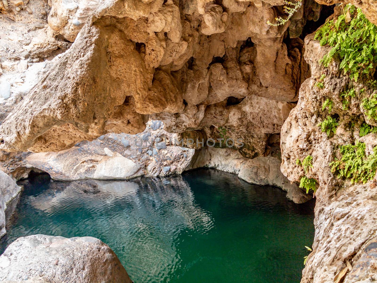 Lagoon in a cave in Wadi near Muscat, Oman by galsand