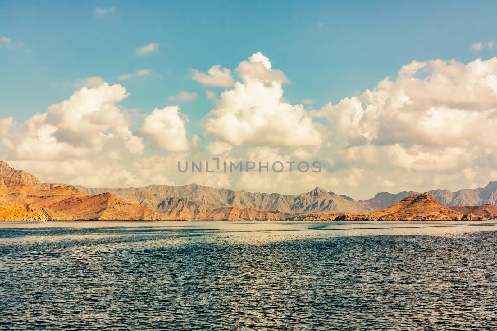Sea and rocky shores in the fjords of the Gulf of Oman, panoramic view.