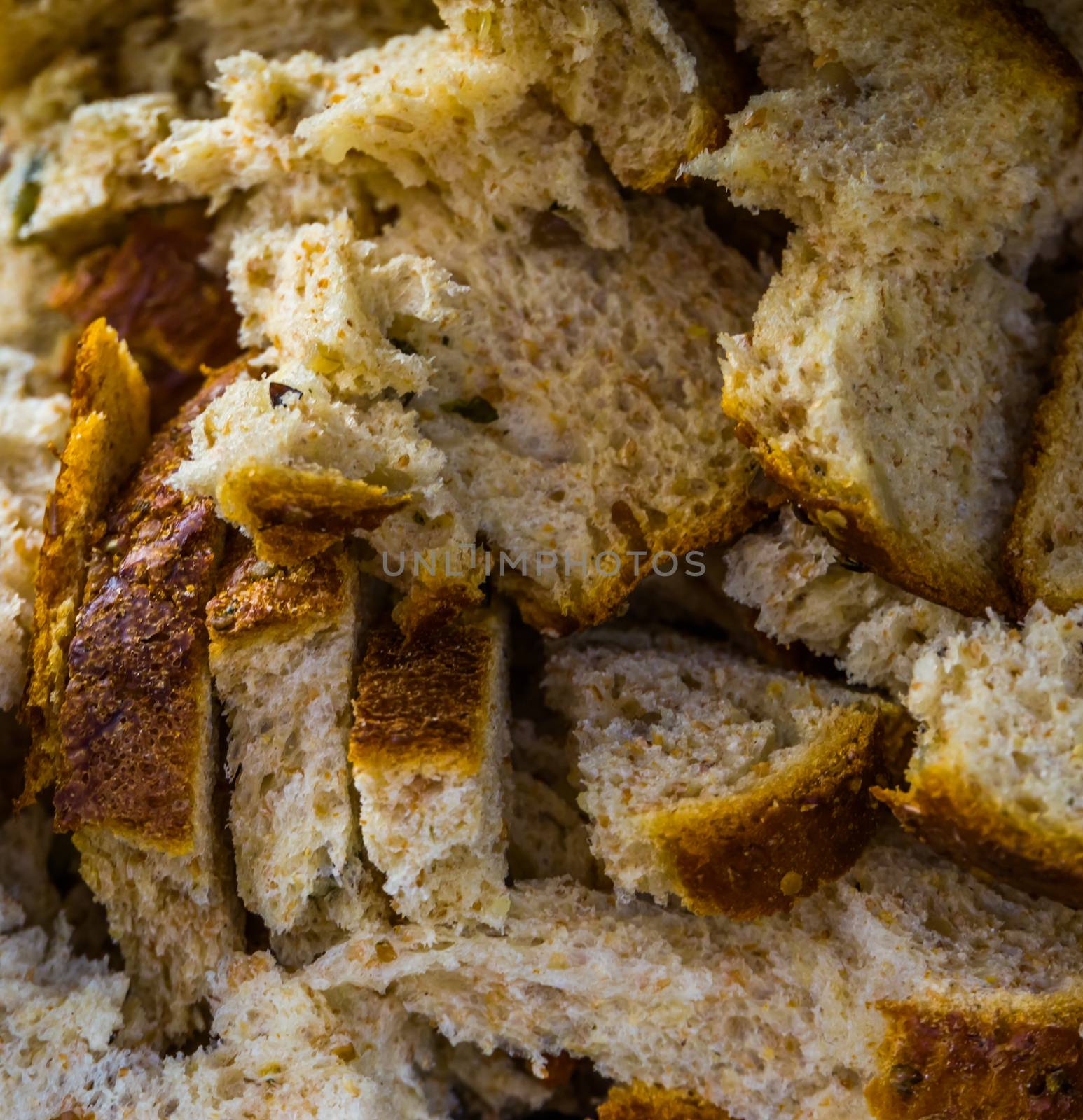 many pieces of bread in macro closeup, bird food, baking industry background