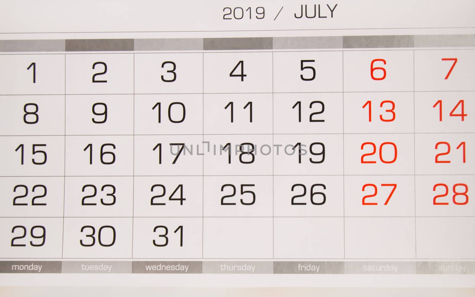 Calendar July 2019 with working days and weekends, close-up top view.