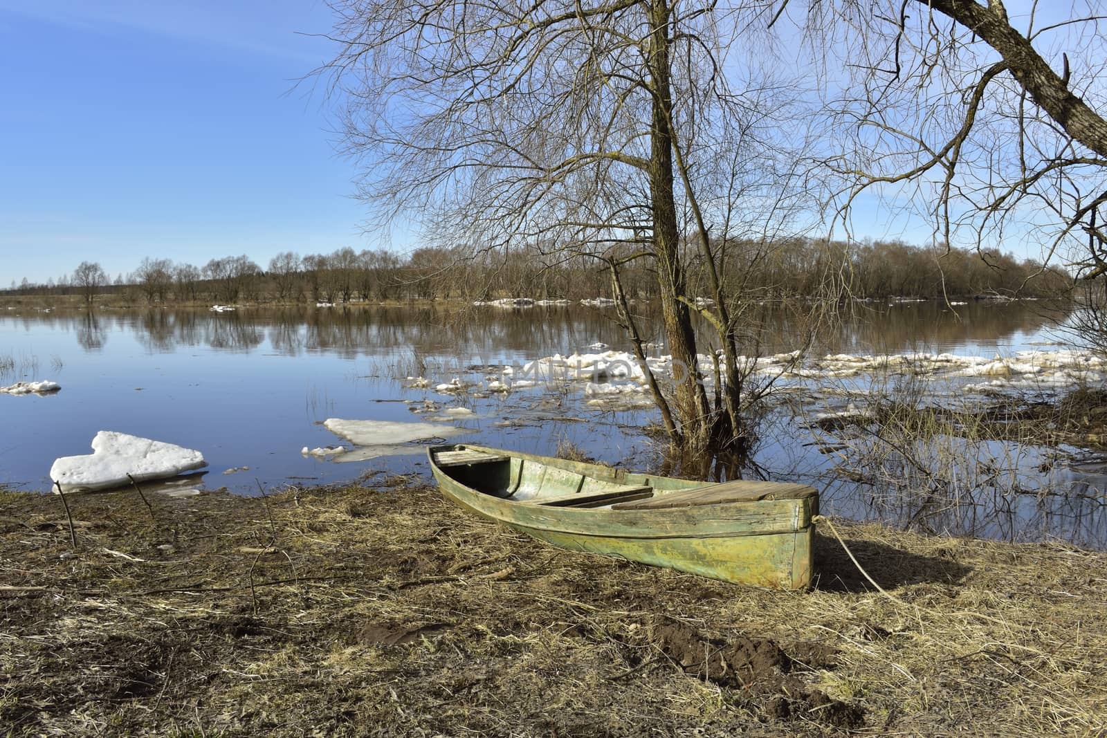 spring spill, boat on the river bank