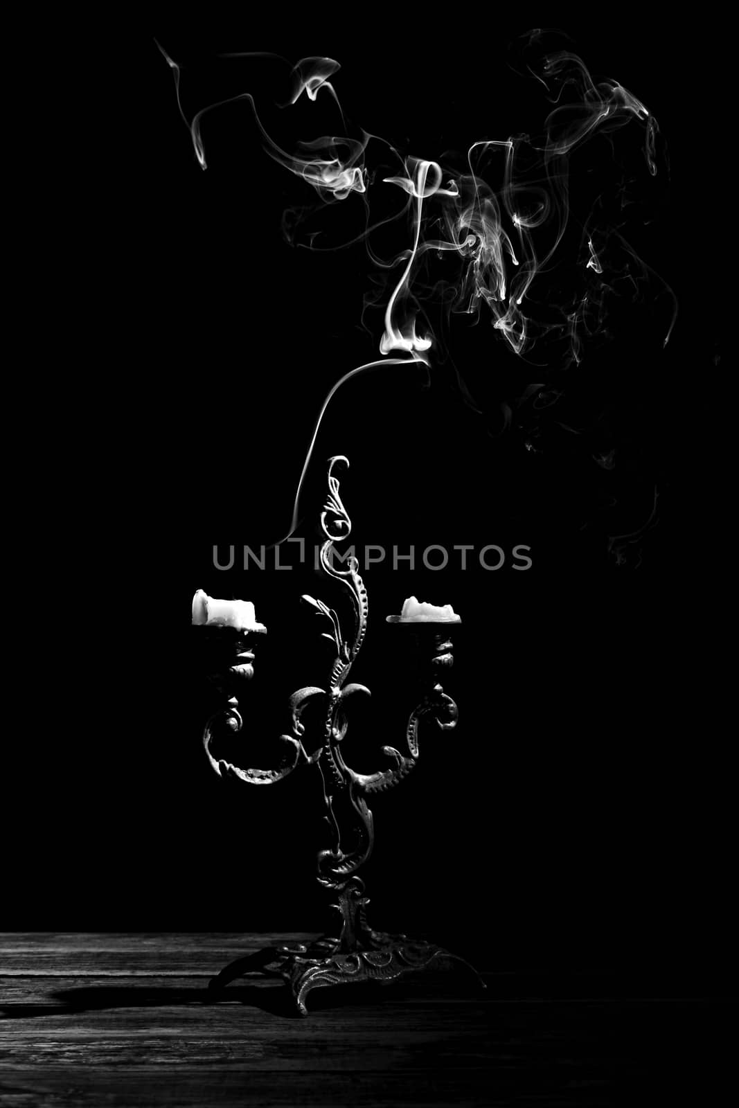 candlestick with extinct candles, black and white image