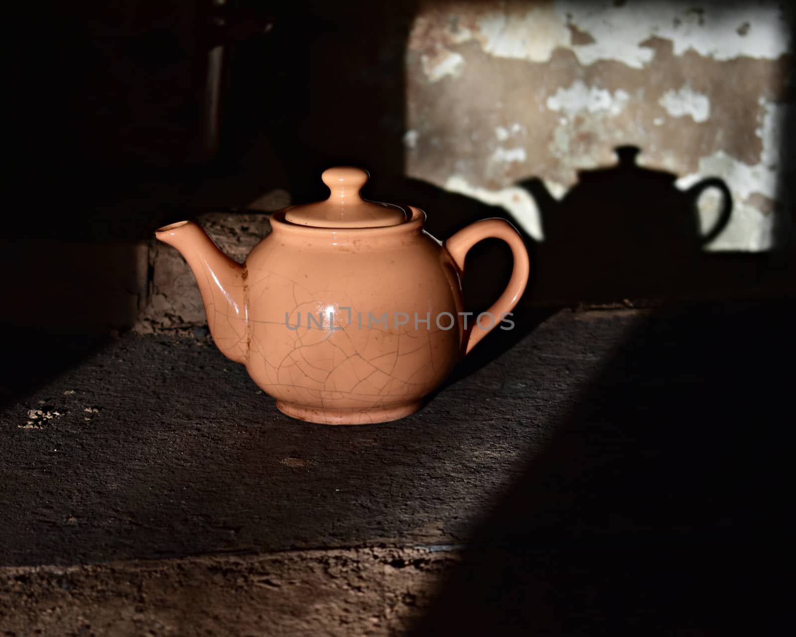 old cracked kettle on the stove, image of village life