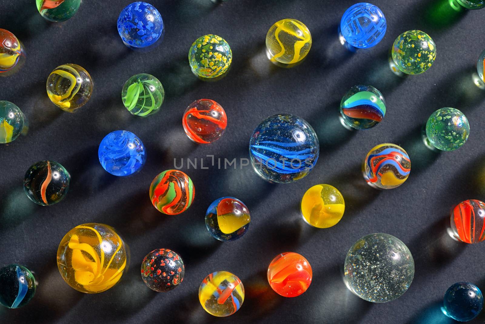 Different glass balls on black background