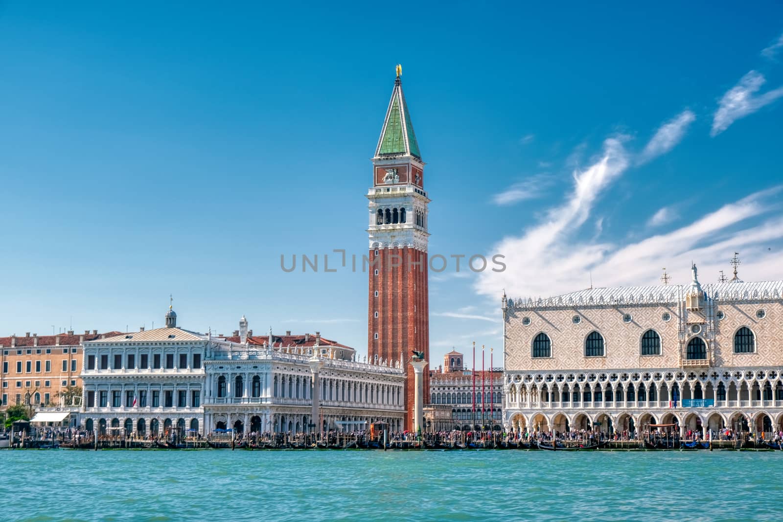 St Mark's Square in Venice, Italy, Piazza San Marco in Venezia with bell tower and the Doge's Palace from the sea, vivid bright colors