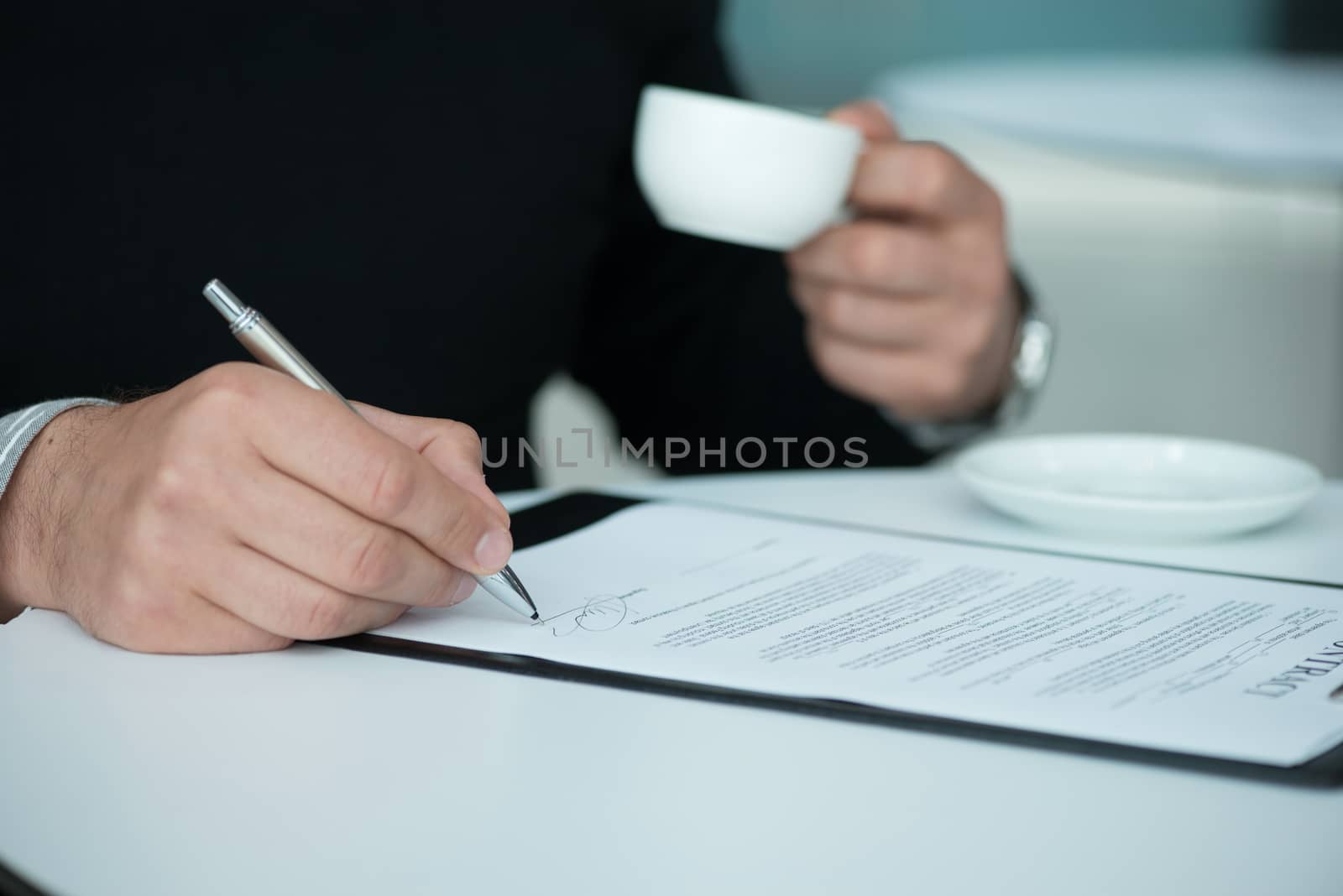 Businessman signing a contract by ALotOfPeople