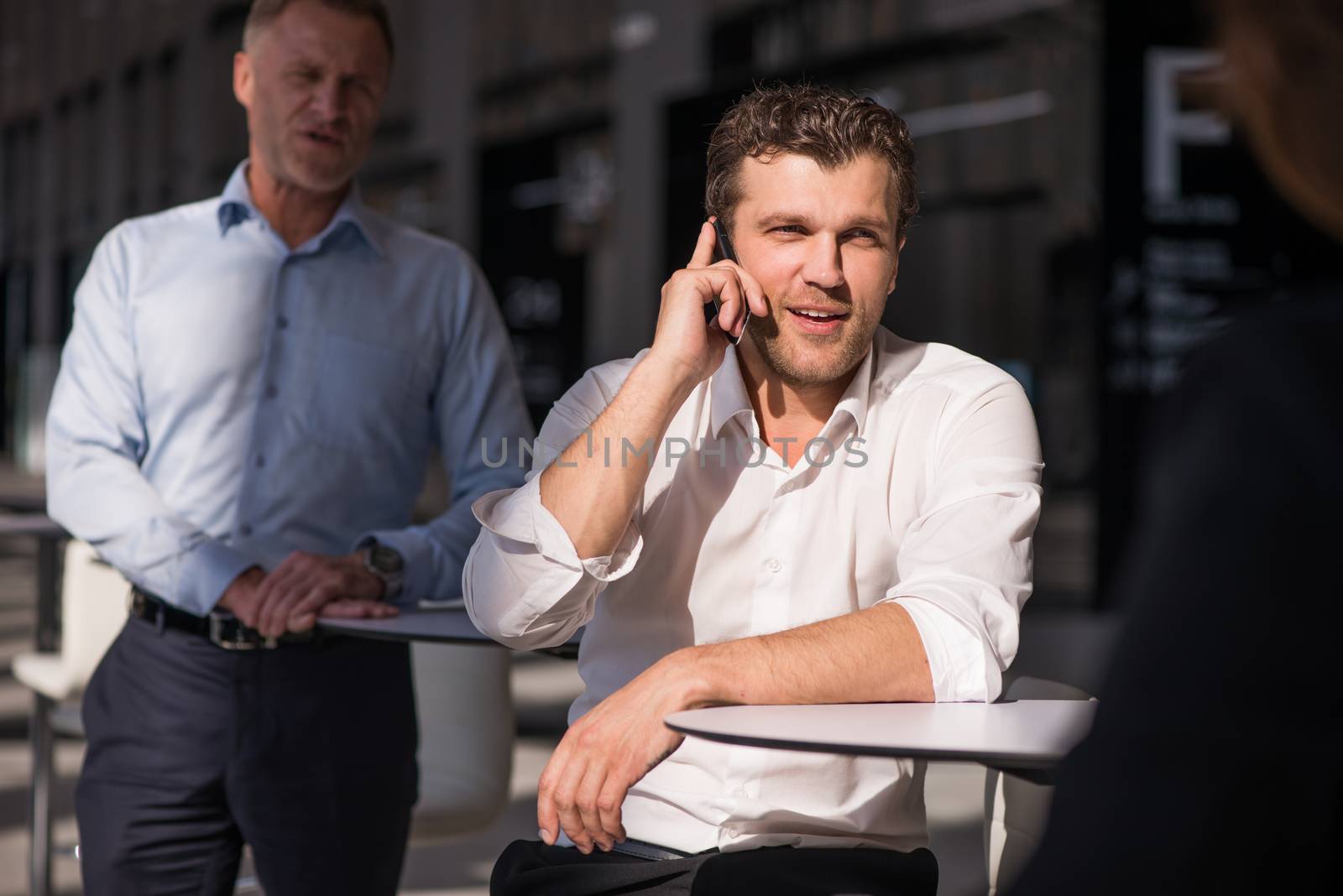 Business man talking on phone by ALotOfPeople