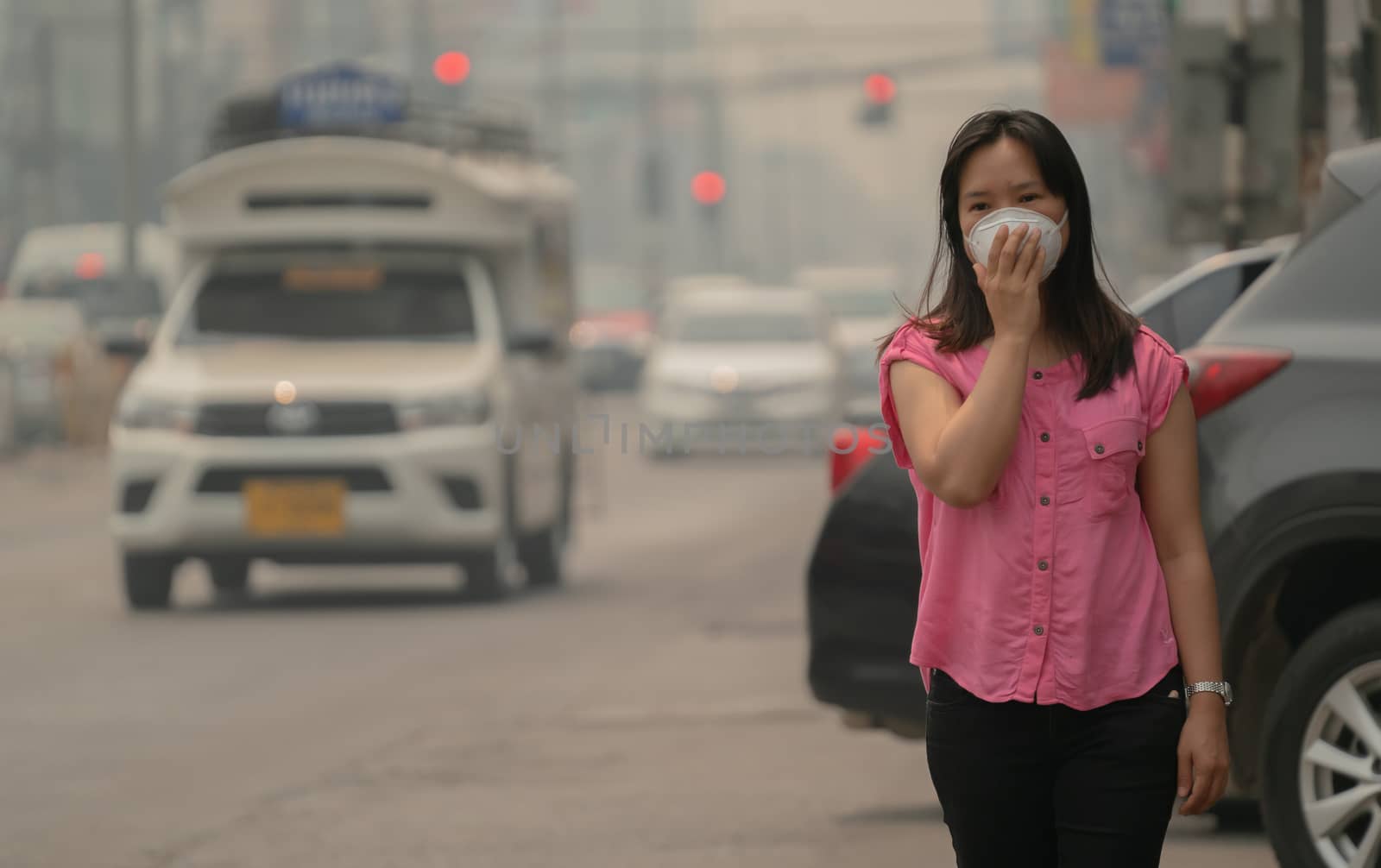 Young woman wearing protective mask  by anankkml