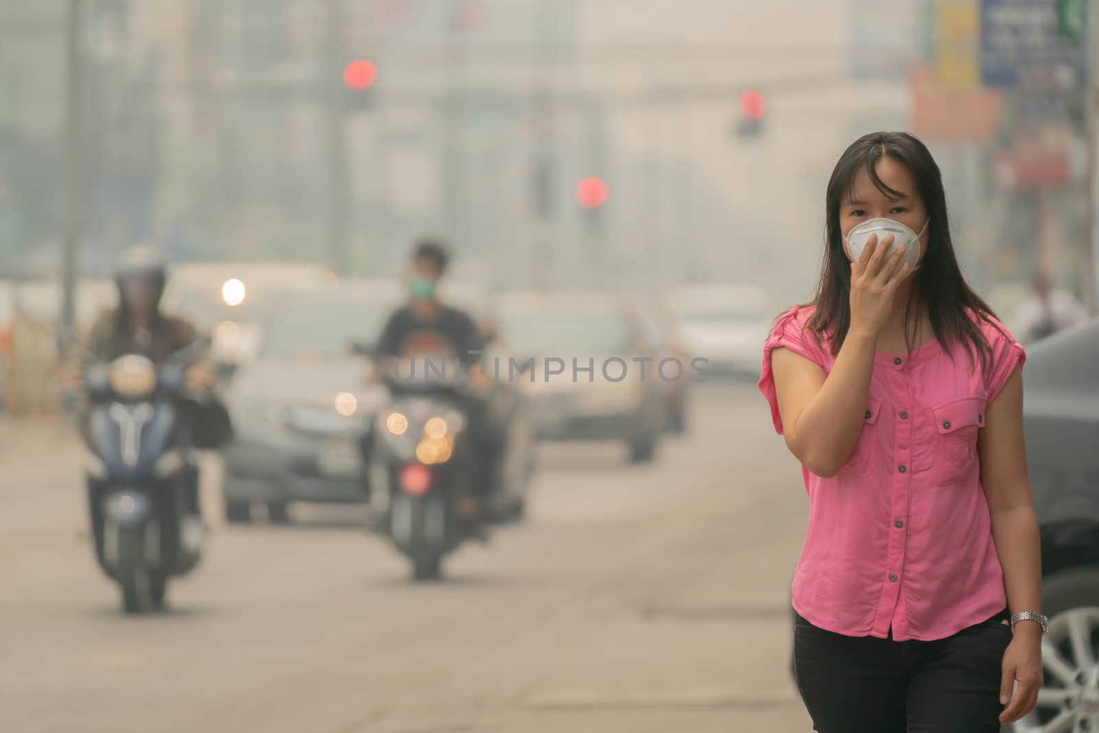 Young woman wearing protective mask in the city street, chiang mai thailand