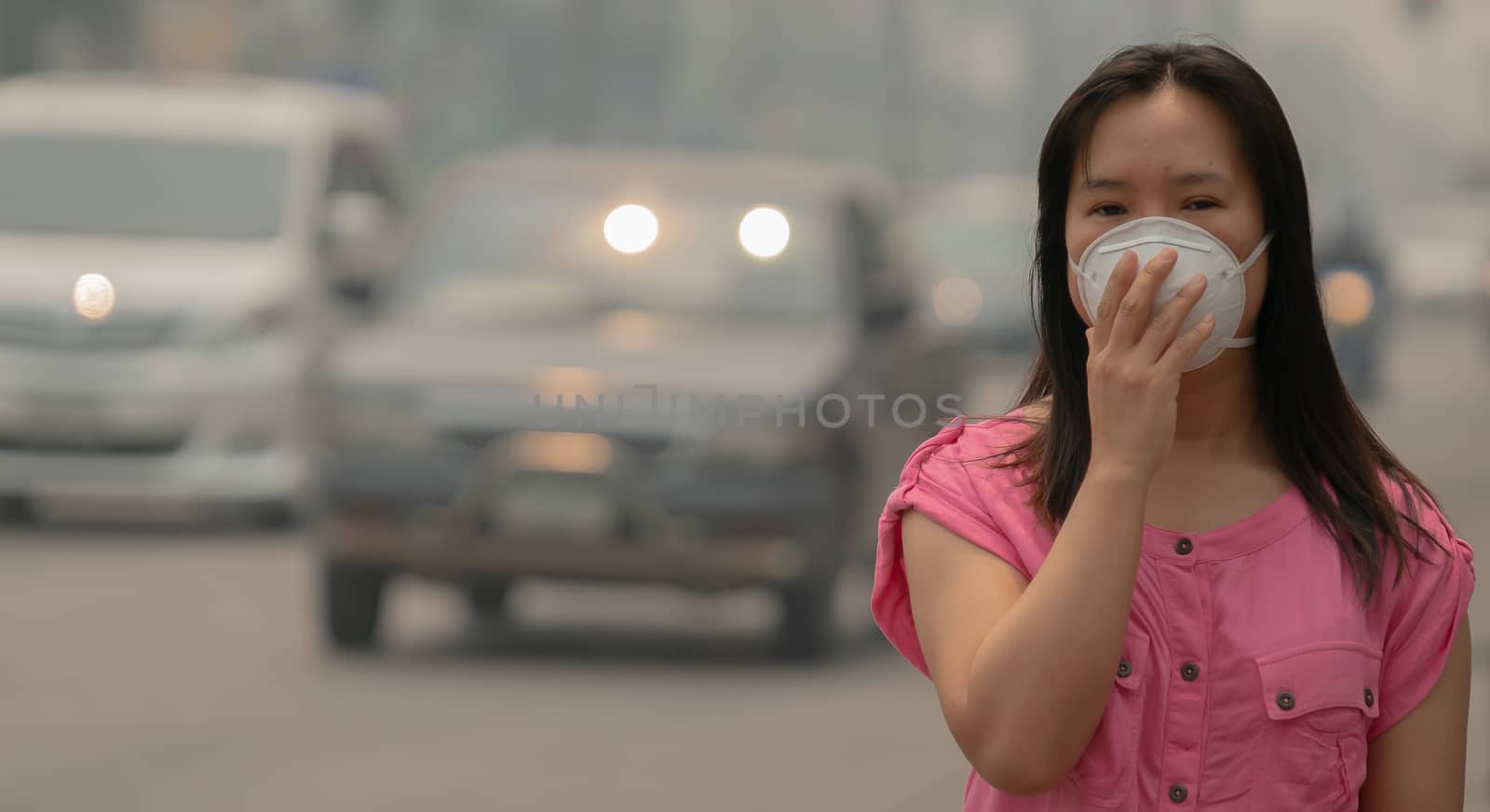 Young woman wearing protective mask in the city street, chiang mai thailand